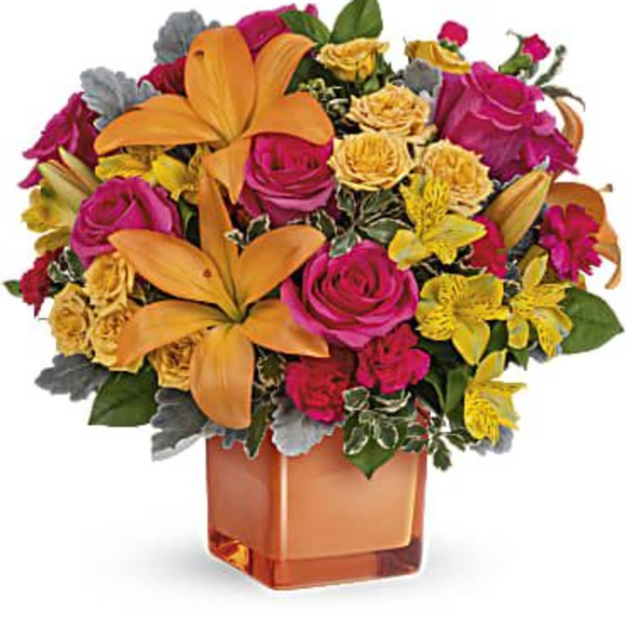 Bouquet of orange lilies, pink roses, and yellow flowers in a square vase