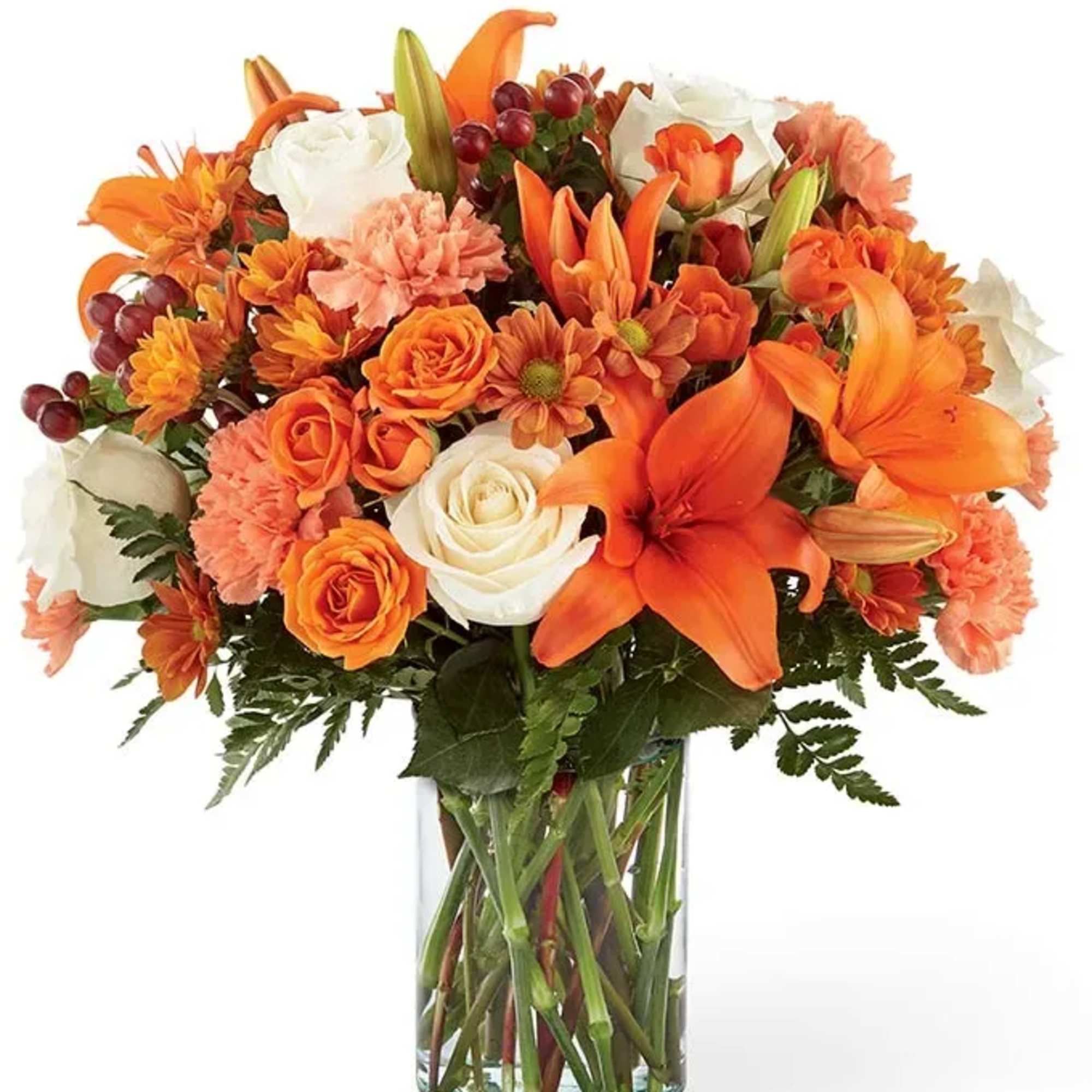 Orange and white mixed bouquet in a clear glass vase
