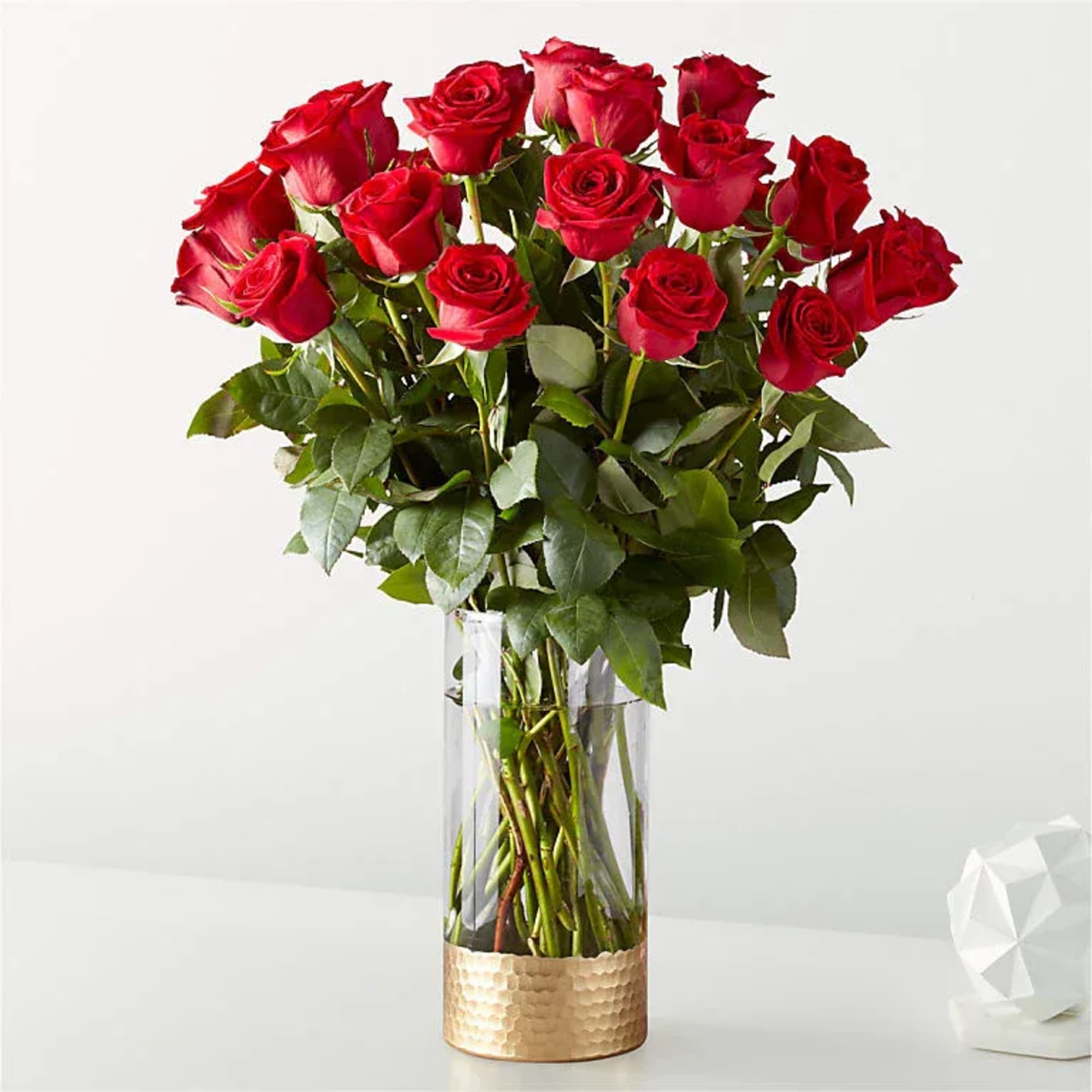 Bouquet of red roses in a clear glass vase