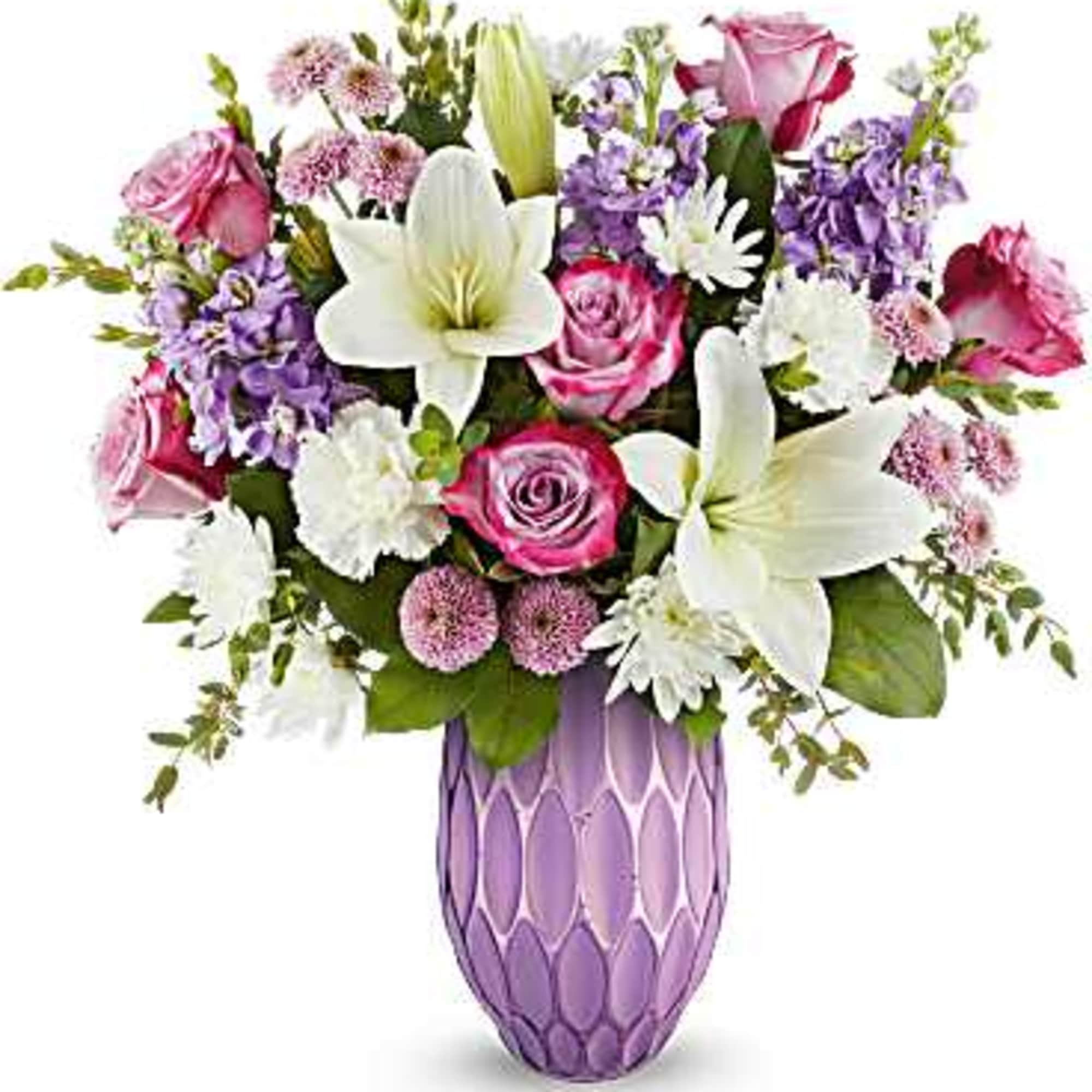 Bouquet of pink and white flowers in a purple vase