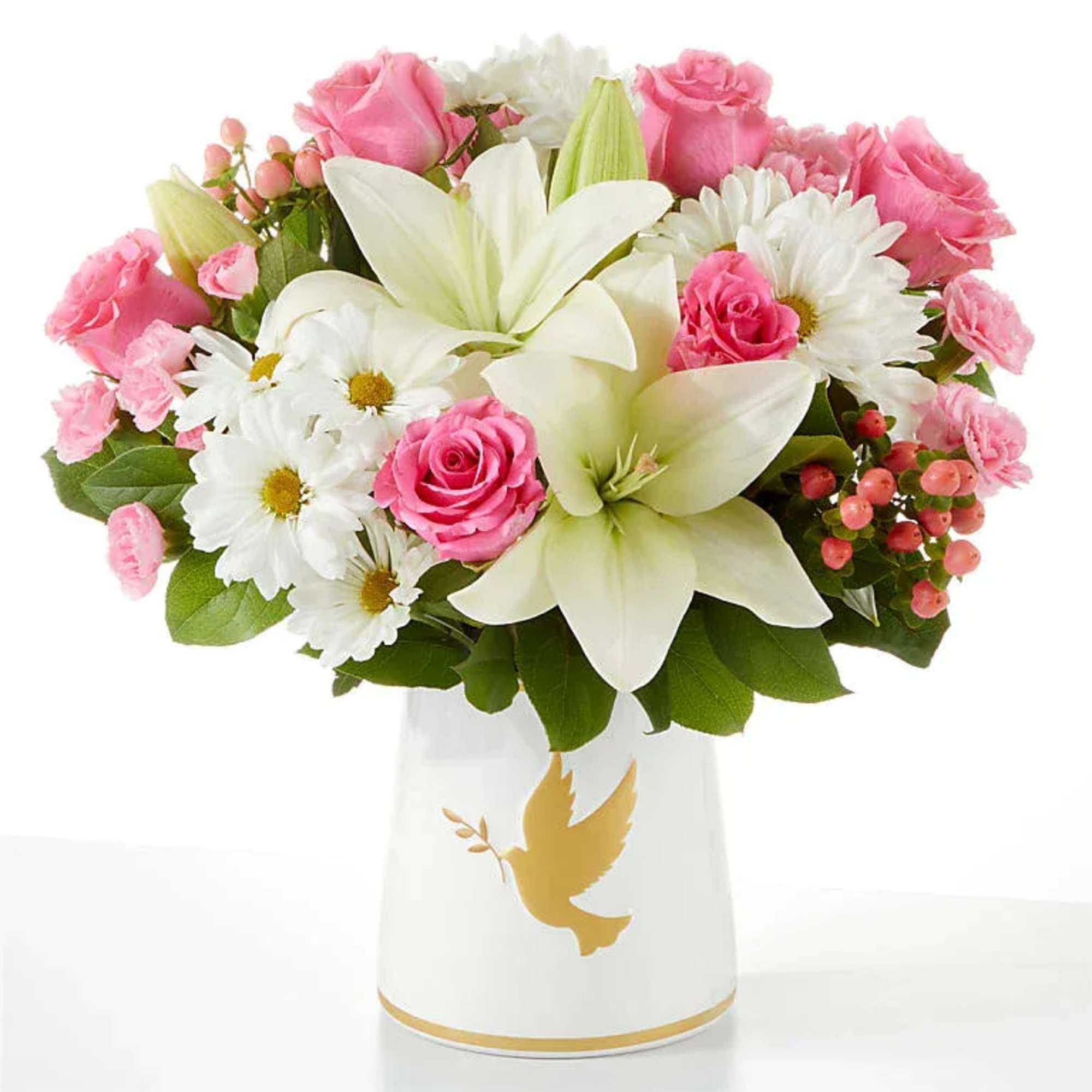 Pink roses and white lilies in a white vase with a gold dove design