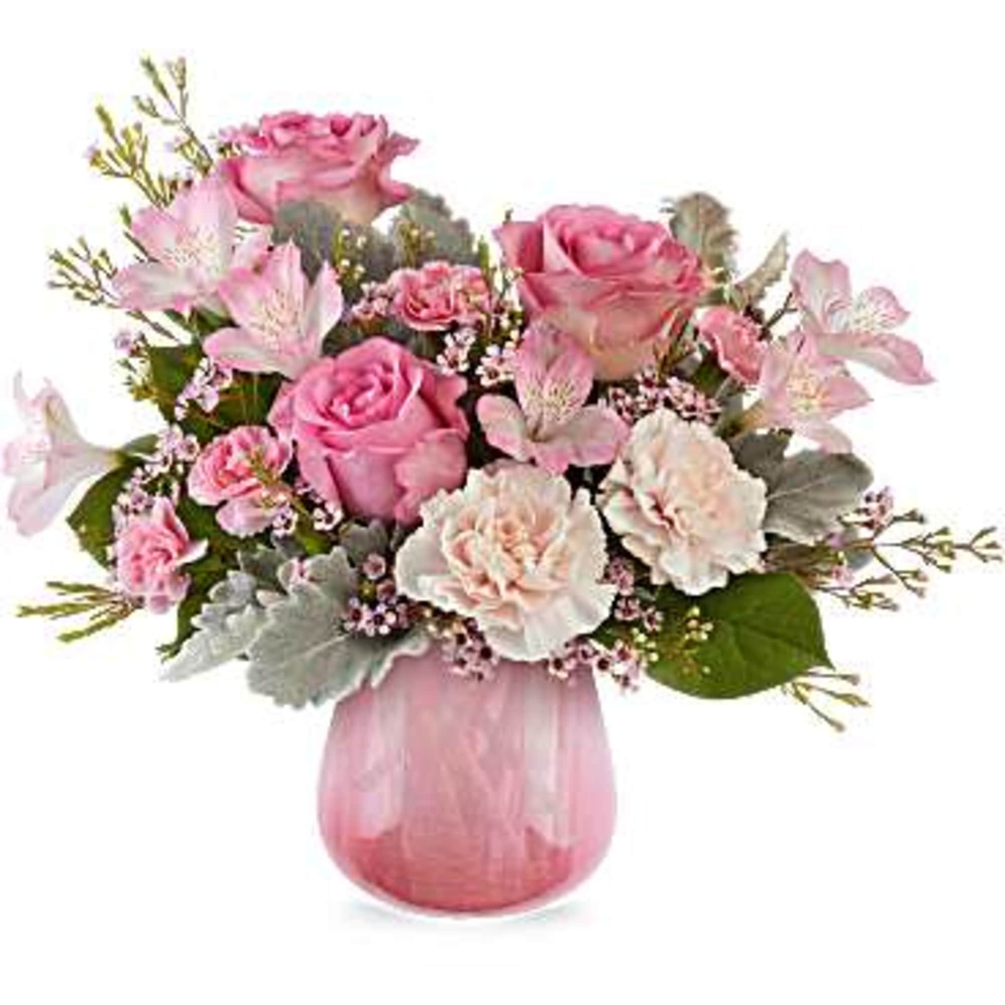 Pink roses and carnations in a pink glass vase