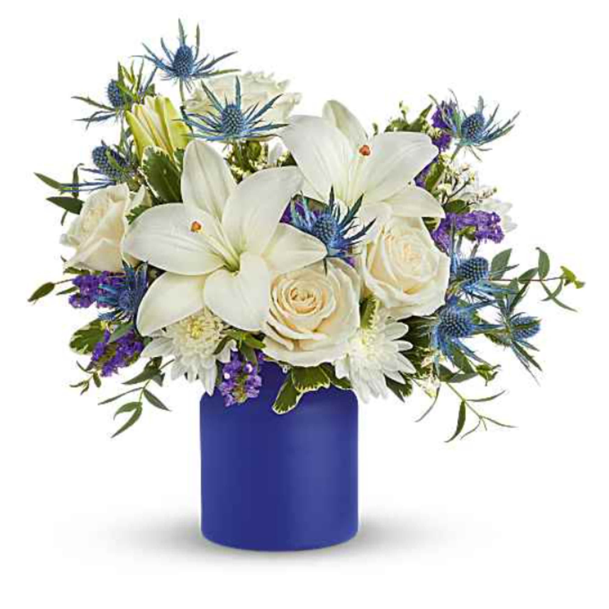 White lilies and roses in a blue vase with purple accents