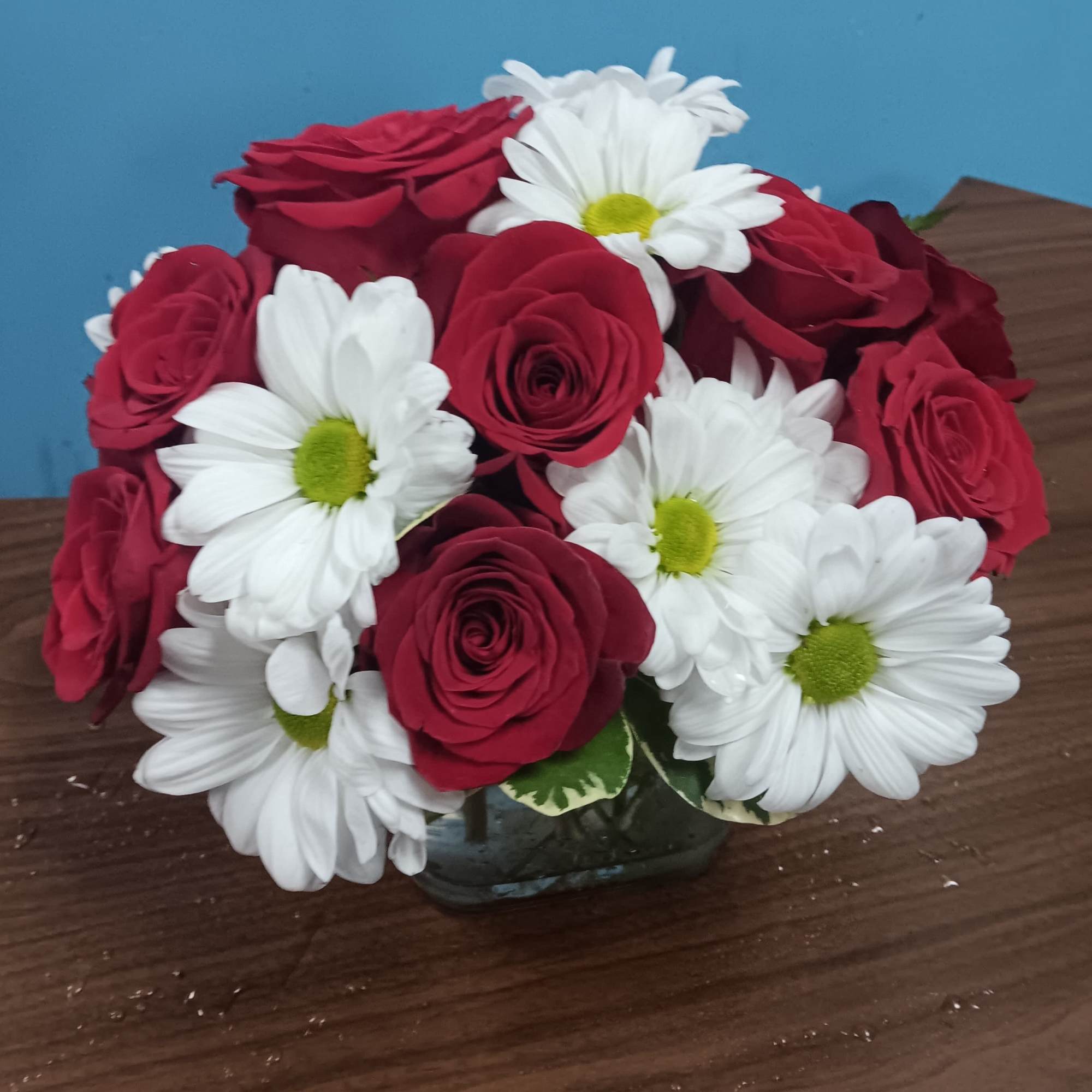 This arrangement contains spray daisies and spray roses. This is a great, photo 2 of 2
