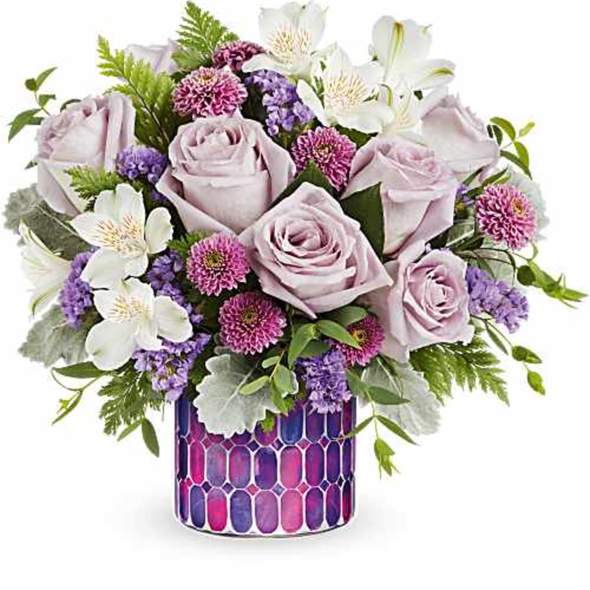 Teleflora's Whimsical Lovelies Bouquet delights with soft pastel blooms arranged in Teleflora's