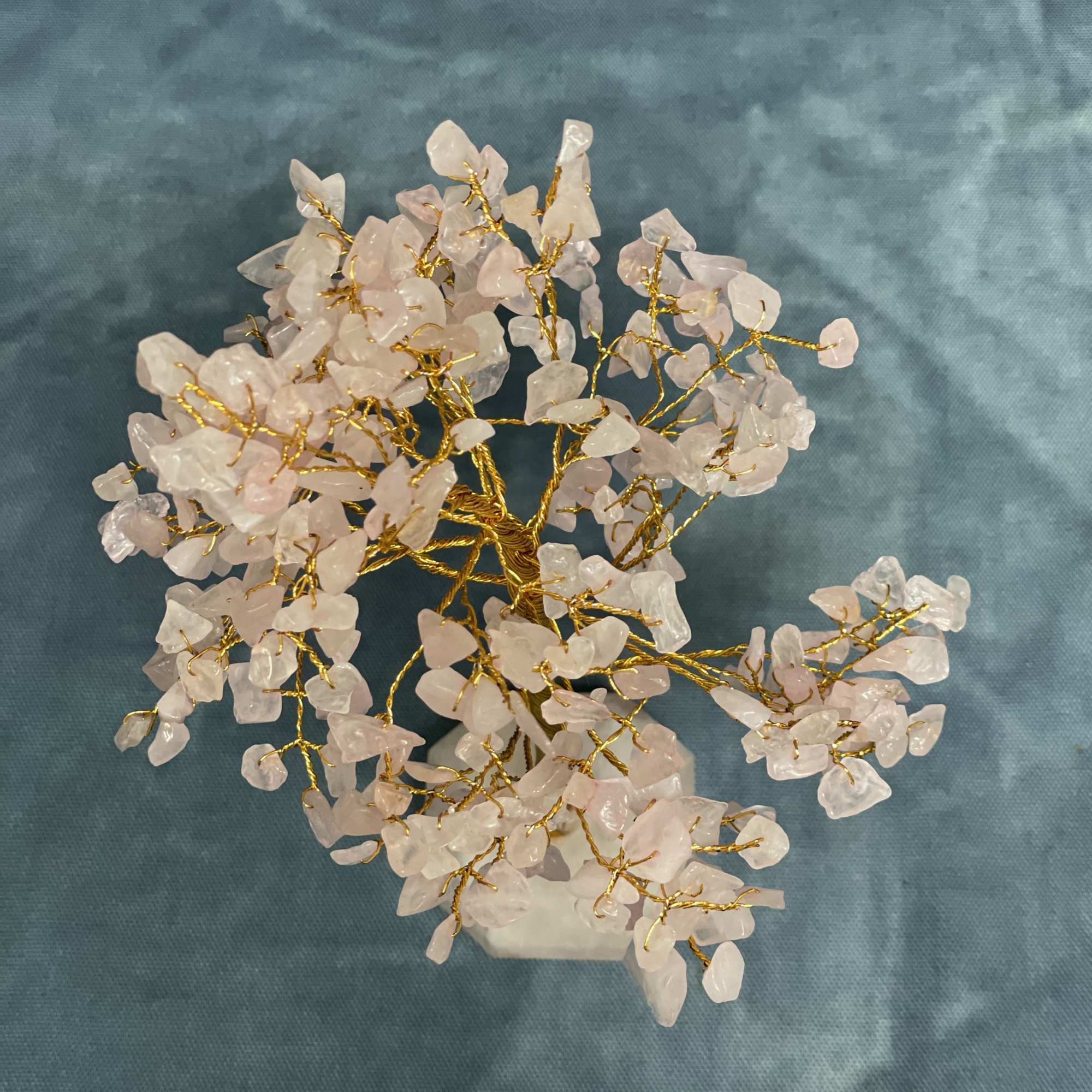 Decorative crystal tree with pale pink stones on gold wire branches