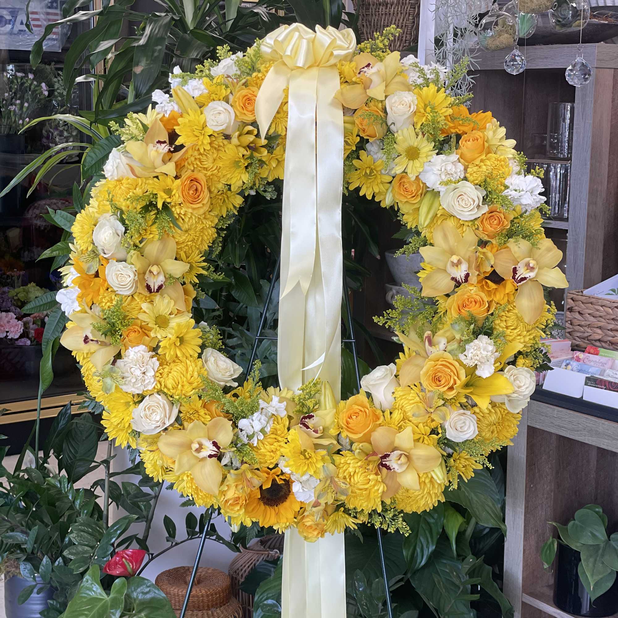A combination of yellow and white flowers such as roses, cymbidium orchids