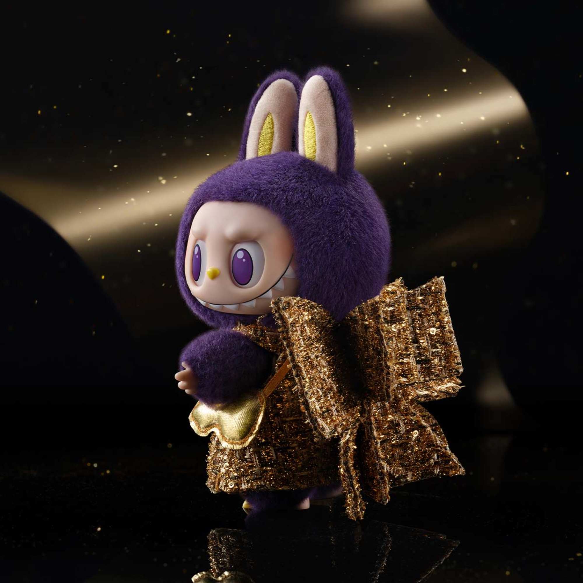 Purple plush toy with bunny ears and gold outfit