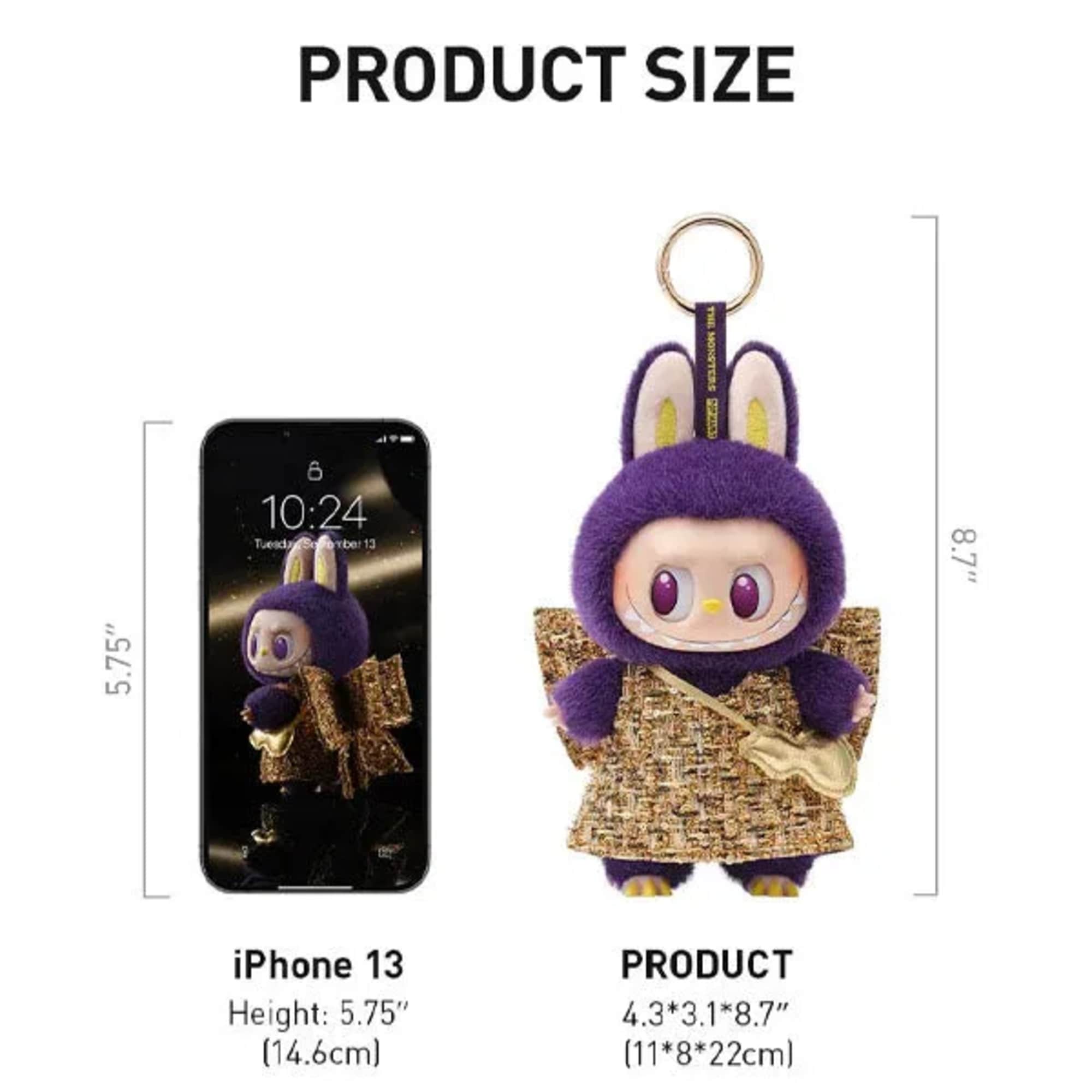 Purple plush character keychain with a gold ring and patterned outfit
