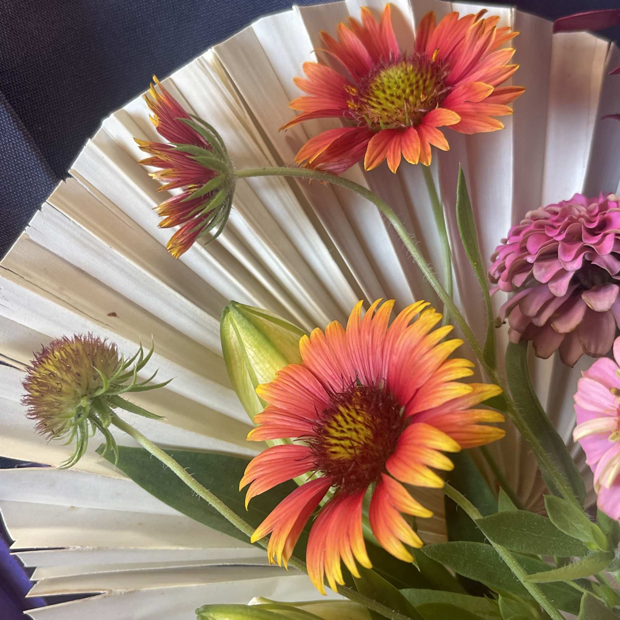 Bouquet of bright gerbera daisies with white paper wrap