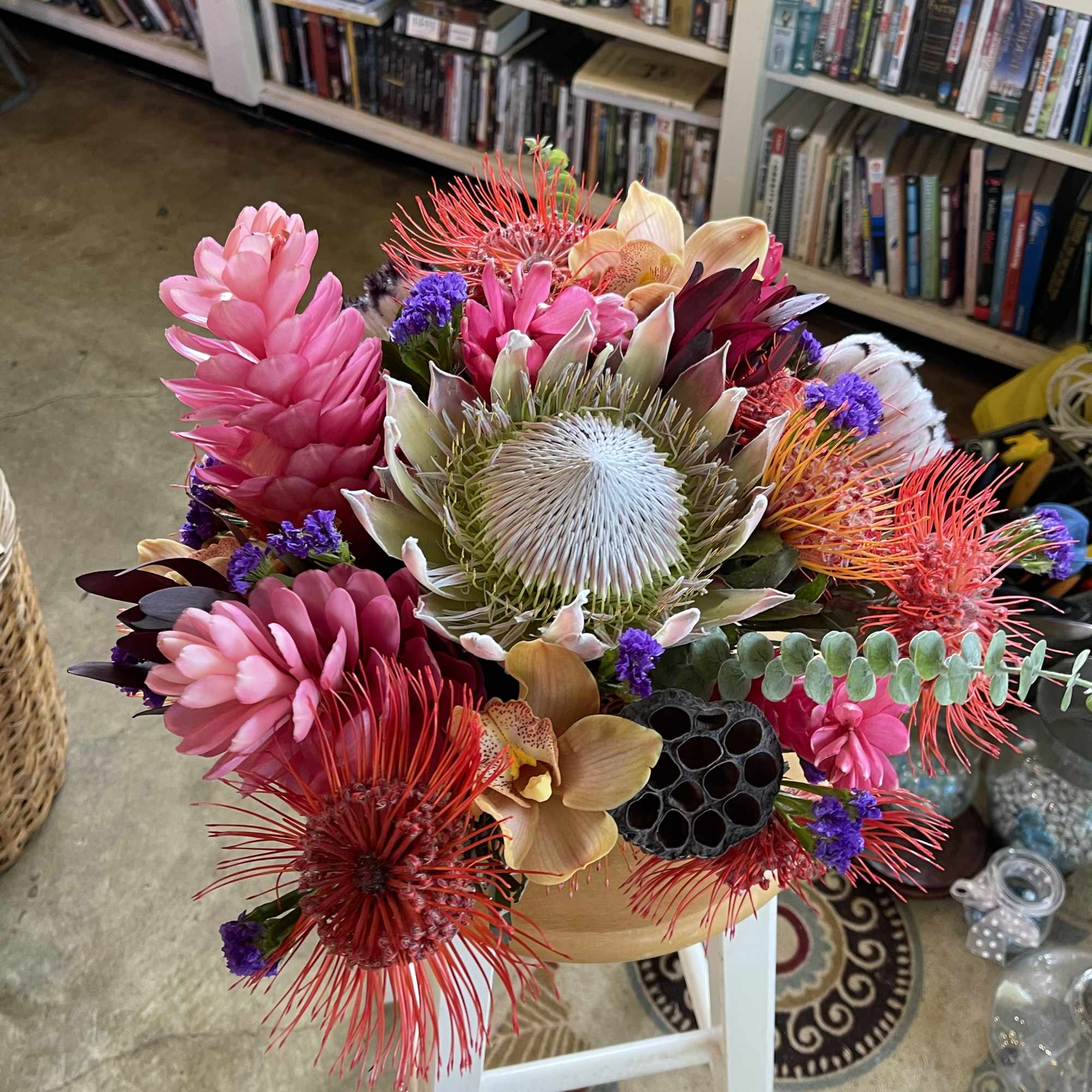 Bright tropical bouquet with pink and red blooms in a vase