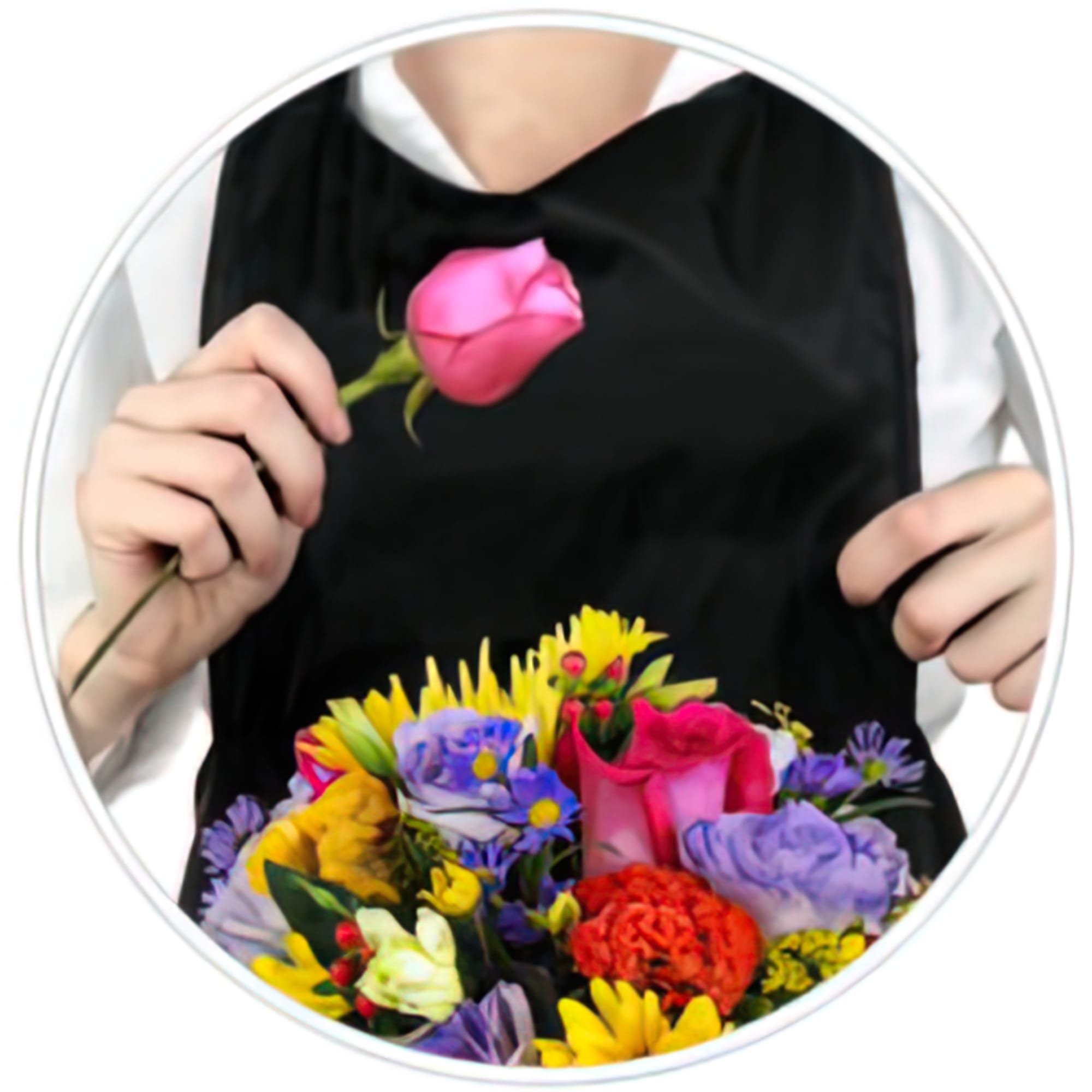 Person holding a pink rose above a colorful mixed bouquet
