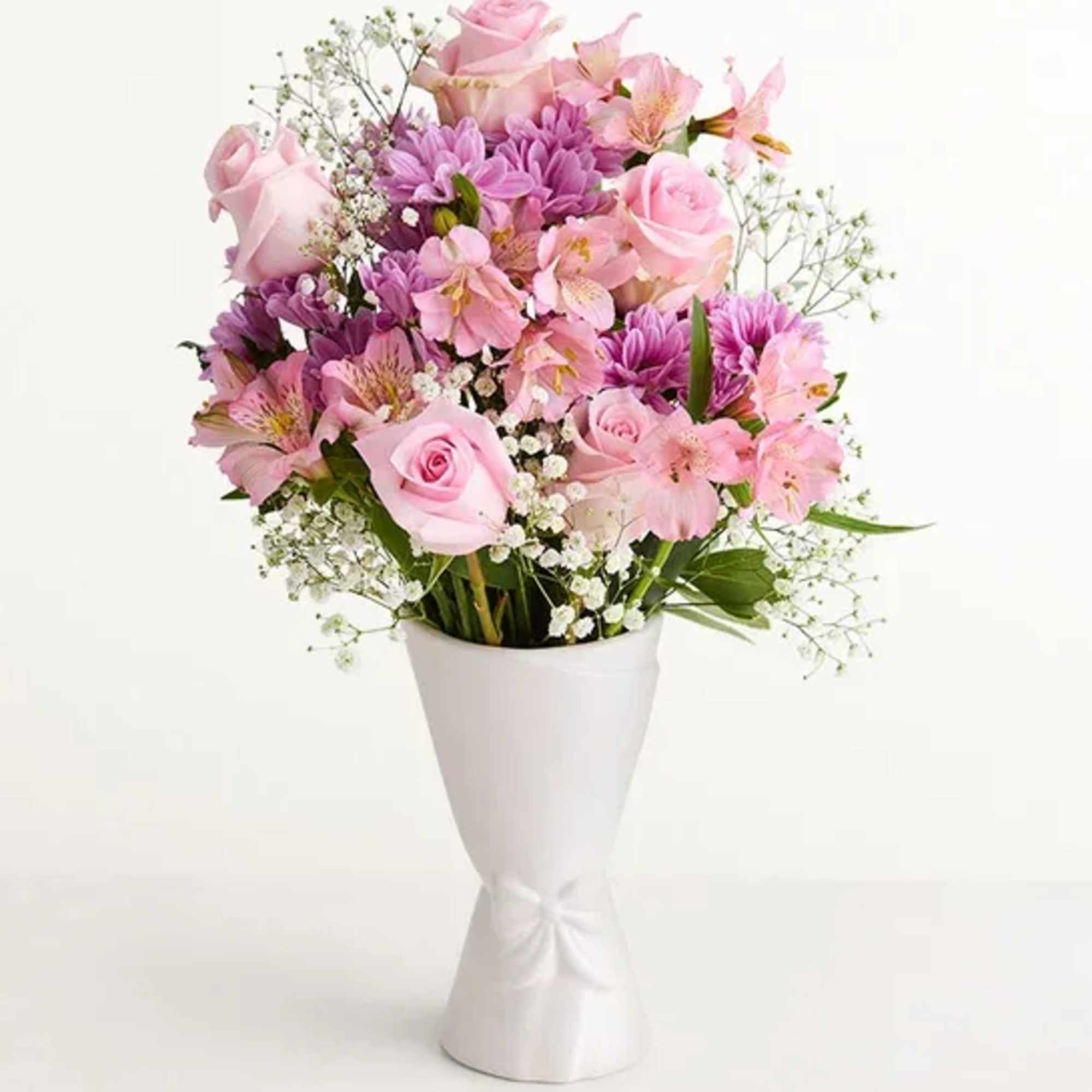 Soft pink roses paired with purple daisy-like blooms and delicate pink alstroemeria