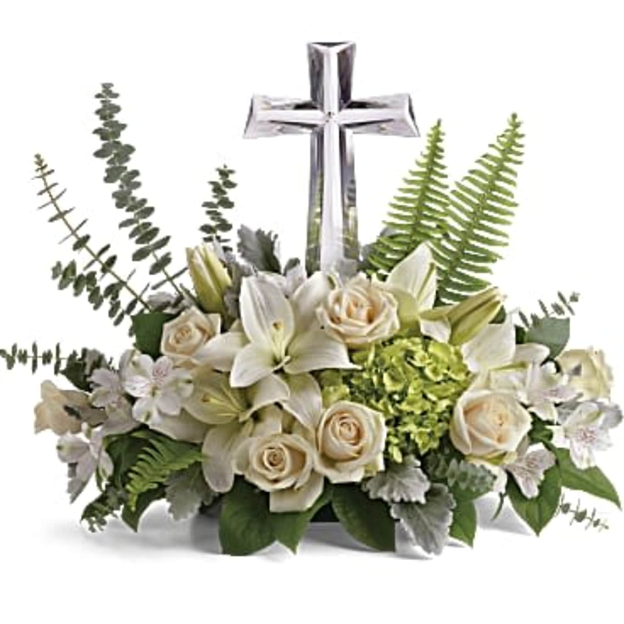 White floral arrangement with a silver cross centerpiece