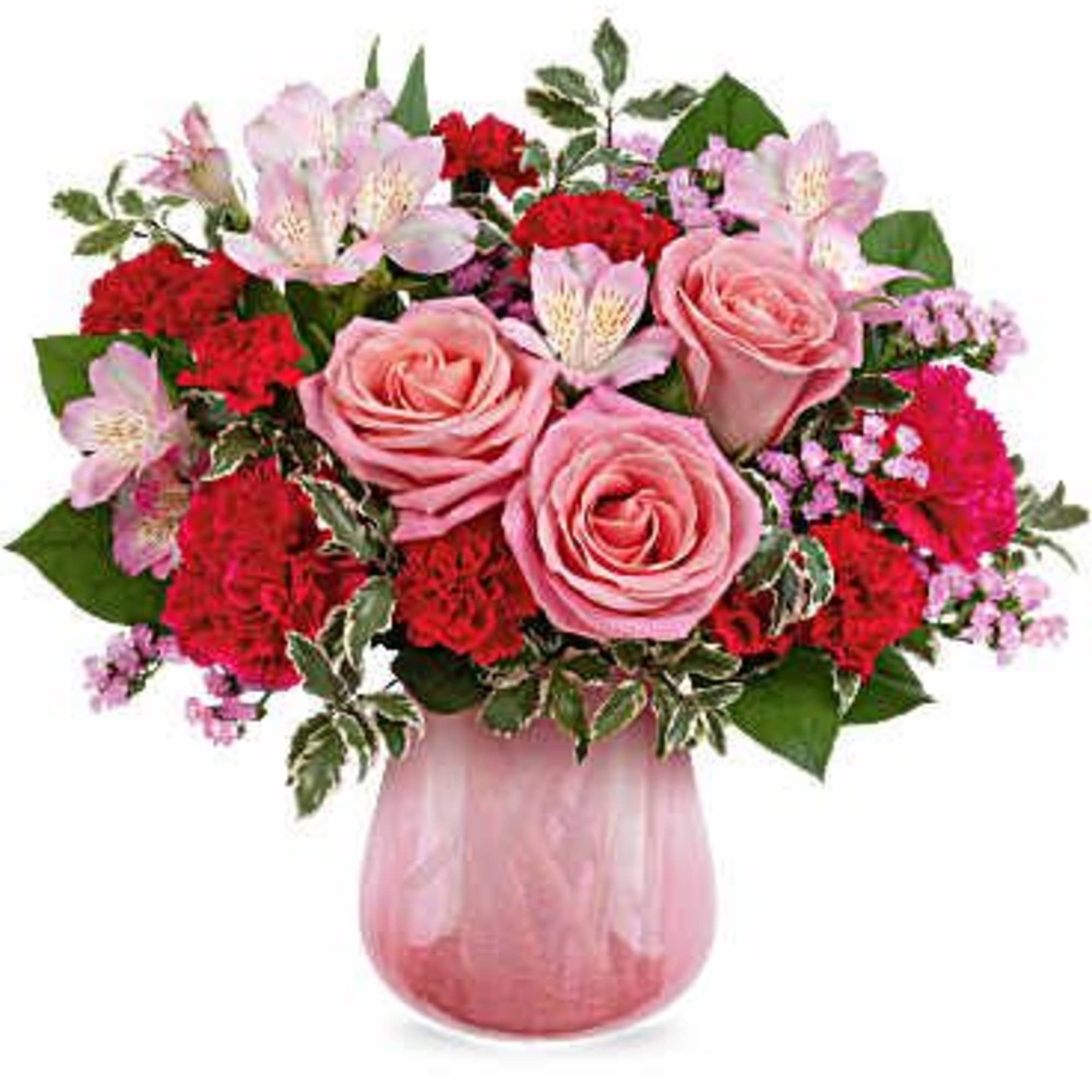 Pink roses and red carnations in a pink glass vase
