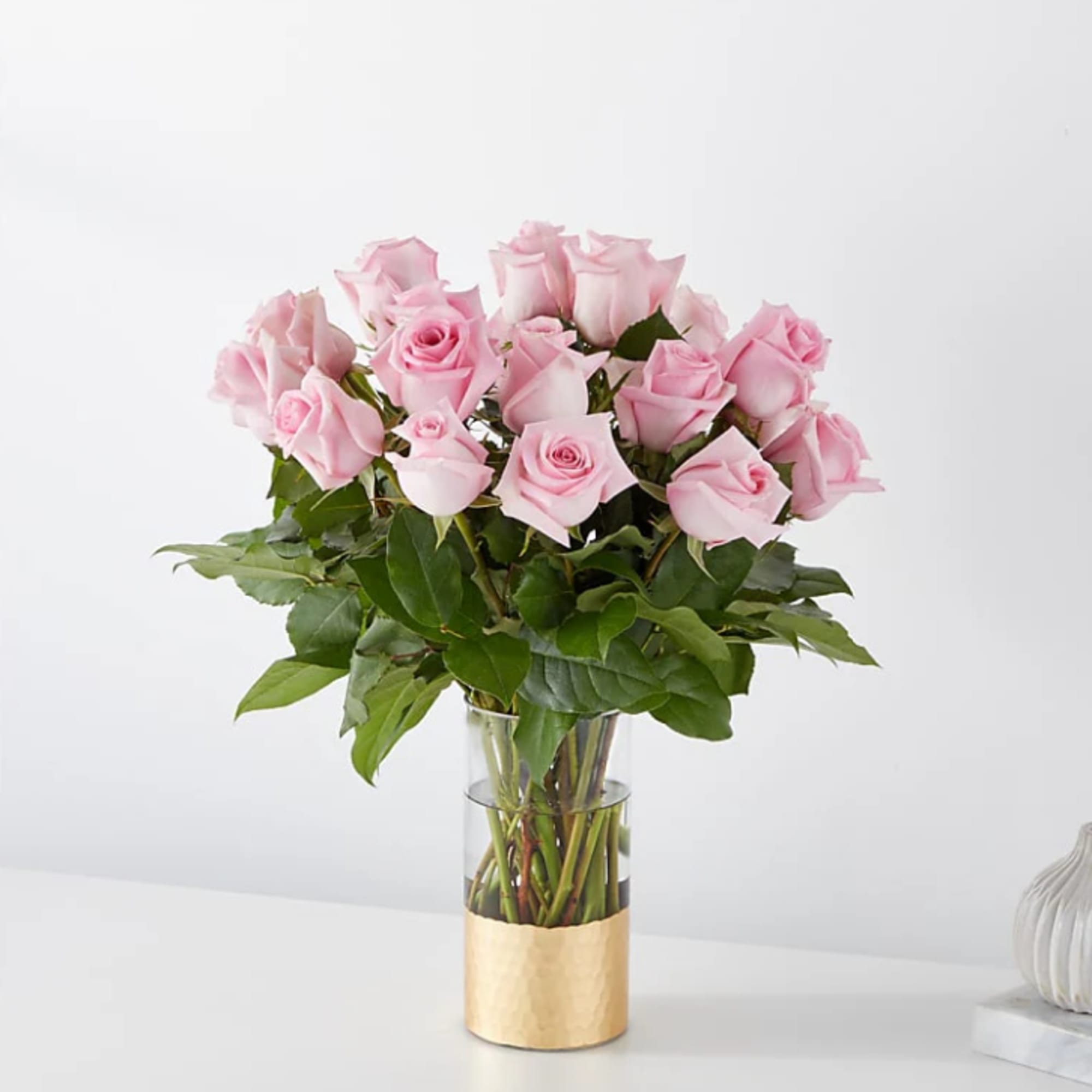 The picture perfect petals of pink roses gracefully unfold, showcasing their timeless
