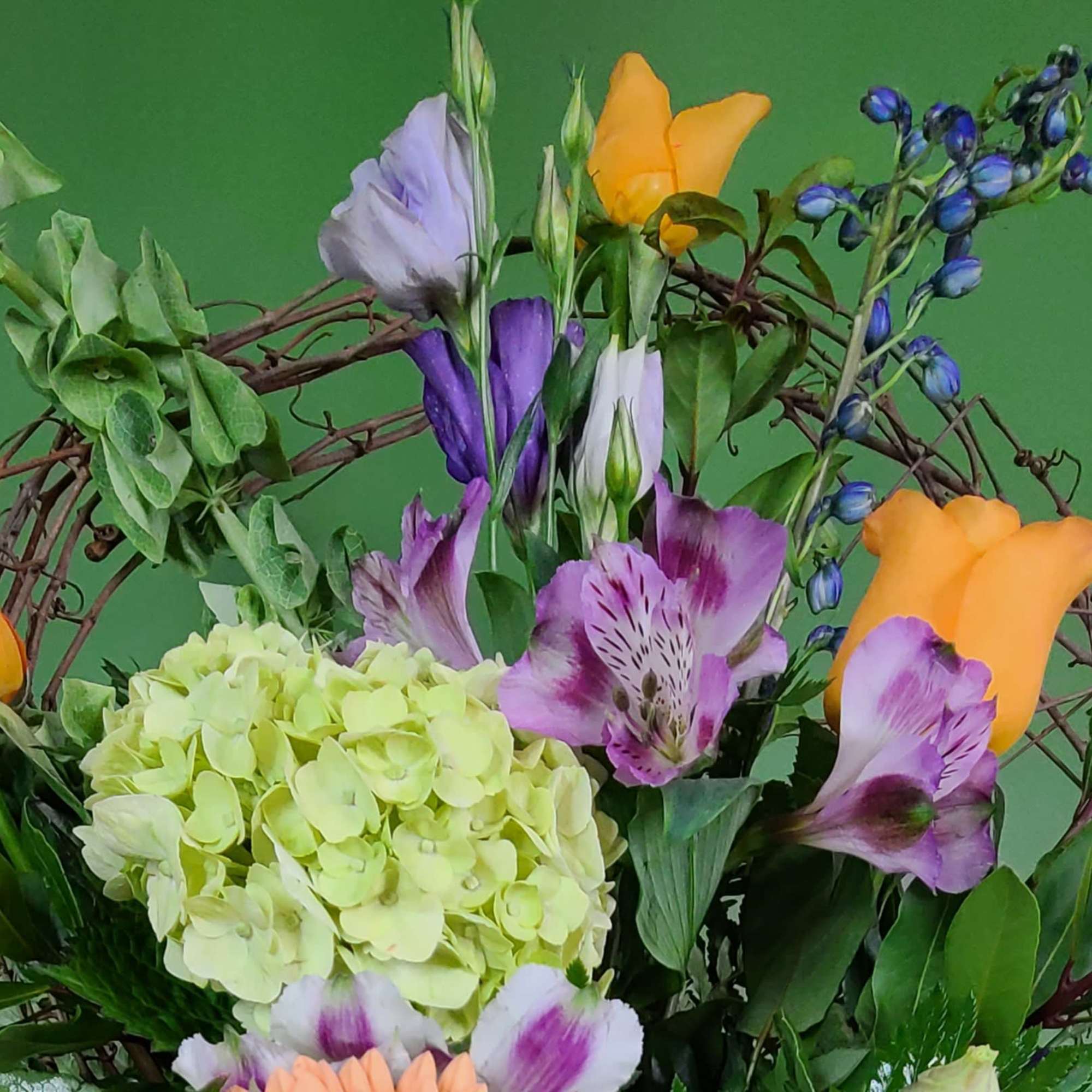 Mixed bouquet with hydrangea, alstroemeria, and orange calla lilies