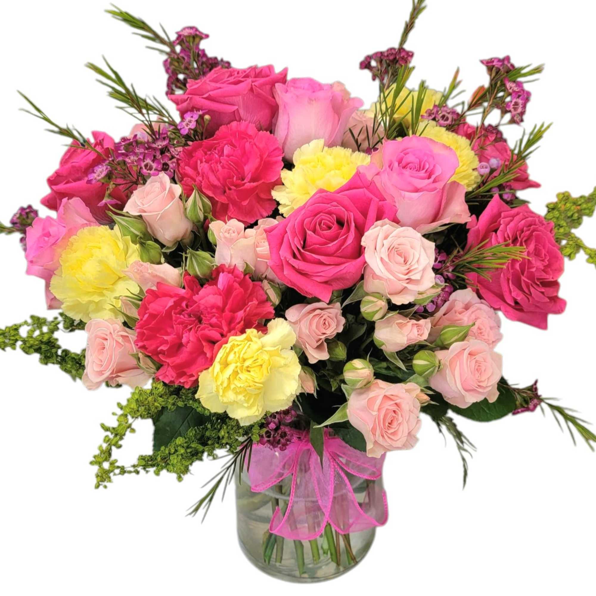 Bouquet of pink and yellow roses and carnations in a glass vase