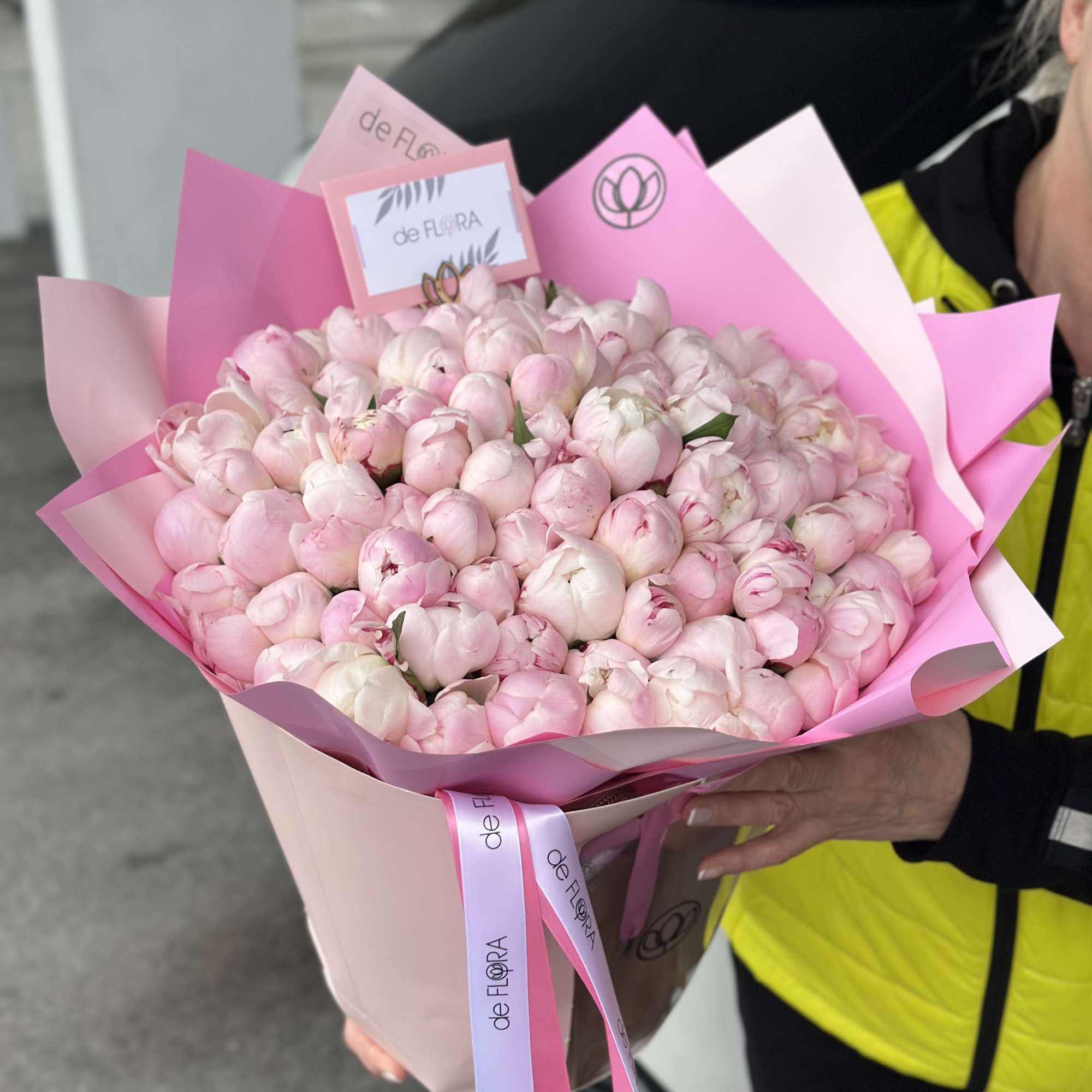 Large bouquet of pale pink peonies wrapped in pink paper, photo 5 of 5