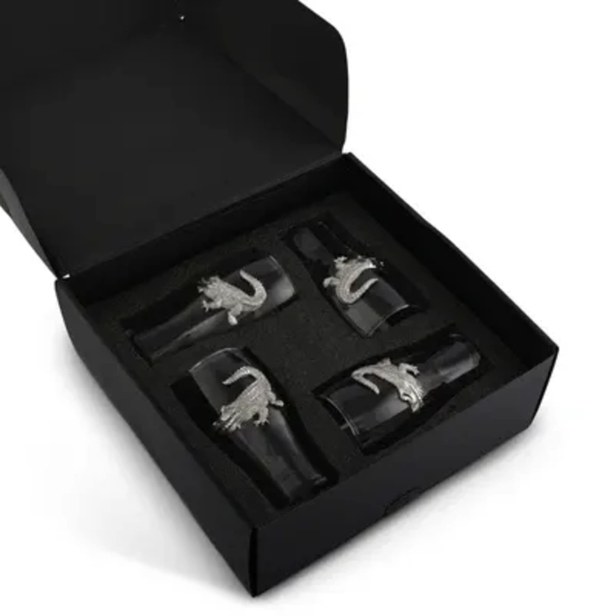 Black gift box with four silver rings inside