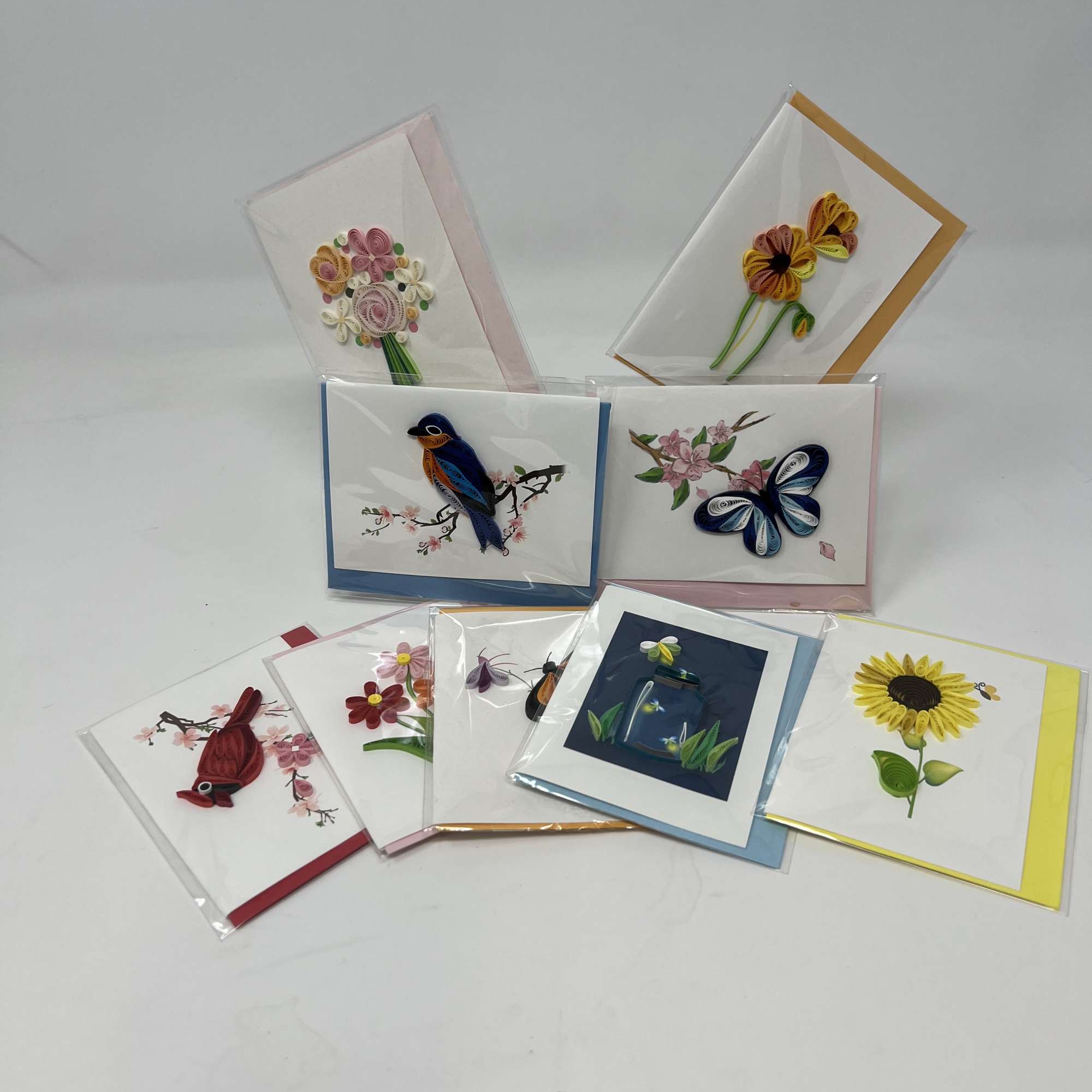 Assorted greeting cards with quilled floral and bird designs