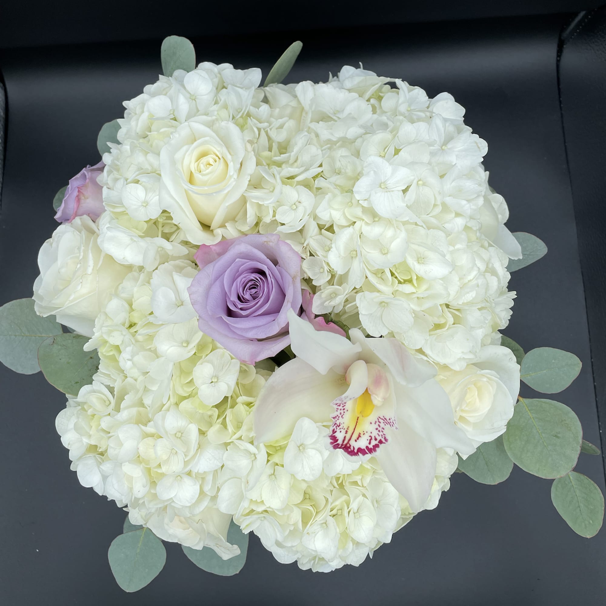 This cylindrical vase of flowers is kind of like a time capsule