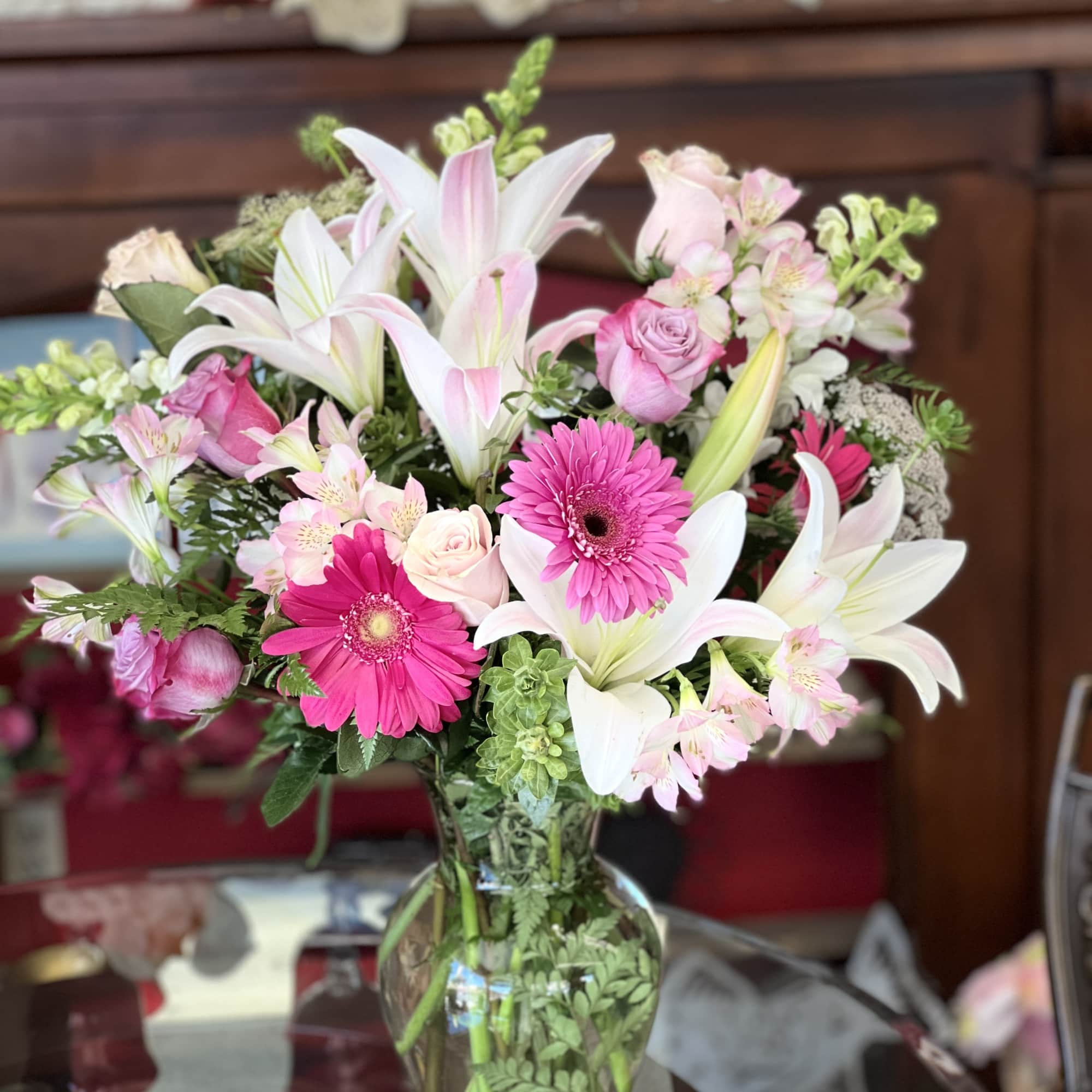 Pink and white mixed bouquet in a clear glass vase