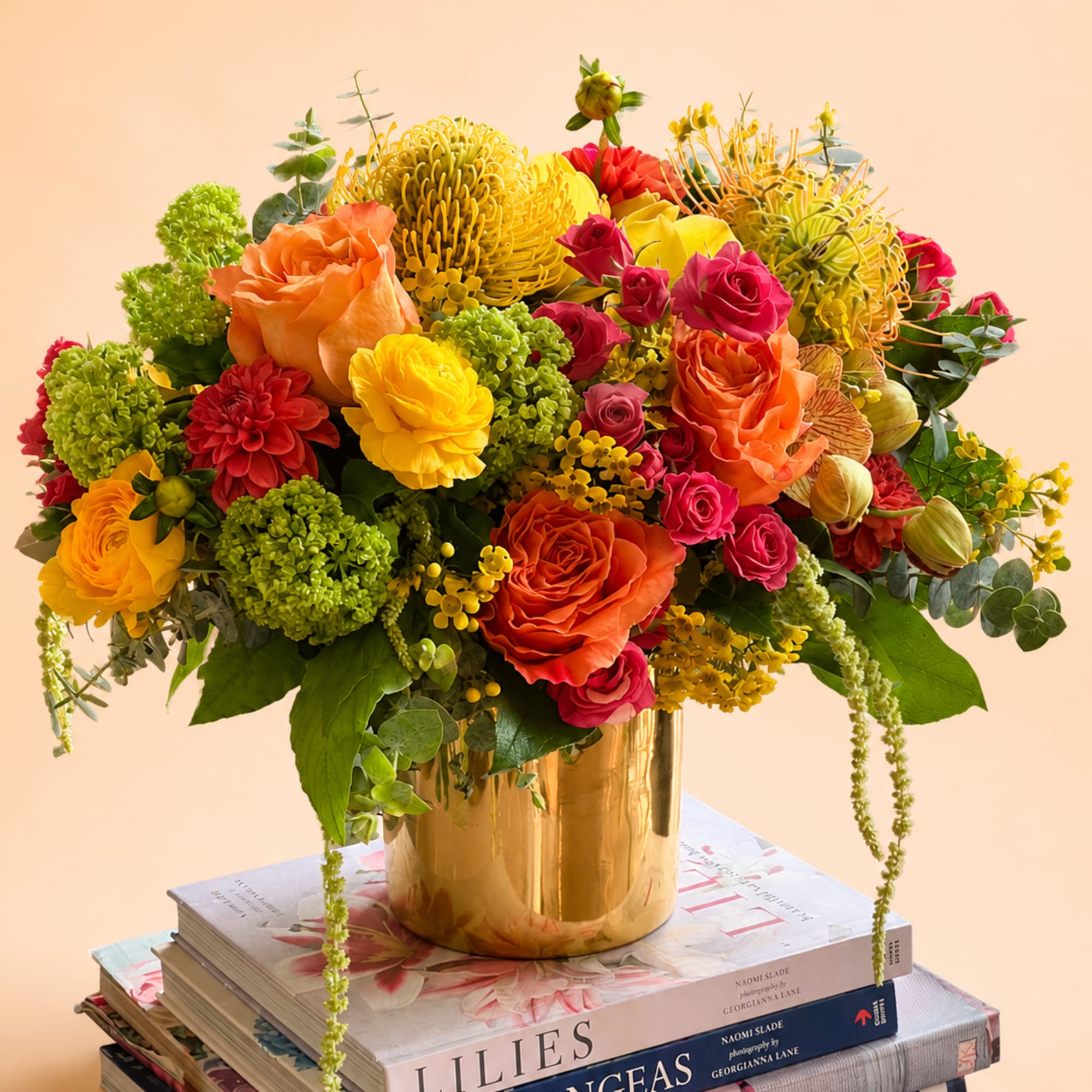 Flowers: free spirit roses, yellow ranunculus, hot pink spray roses, green viburnum