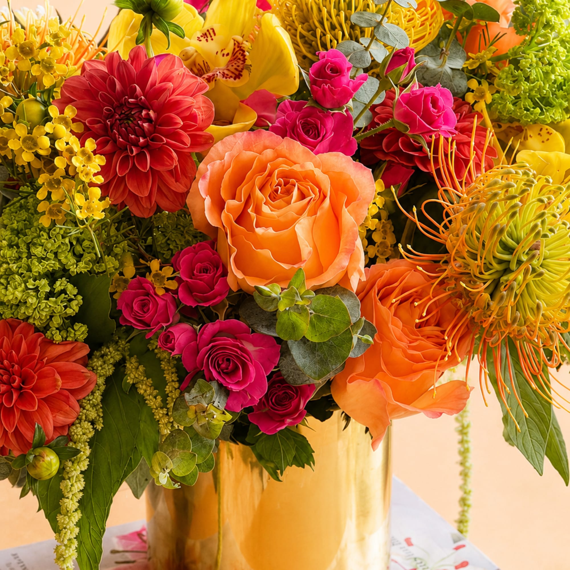 Flowers: free spirit roses, yellow ranunculus, hot pink spray roses, green viburnum