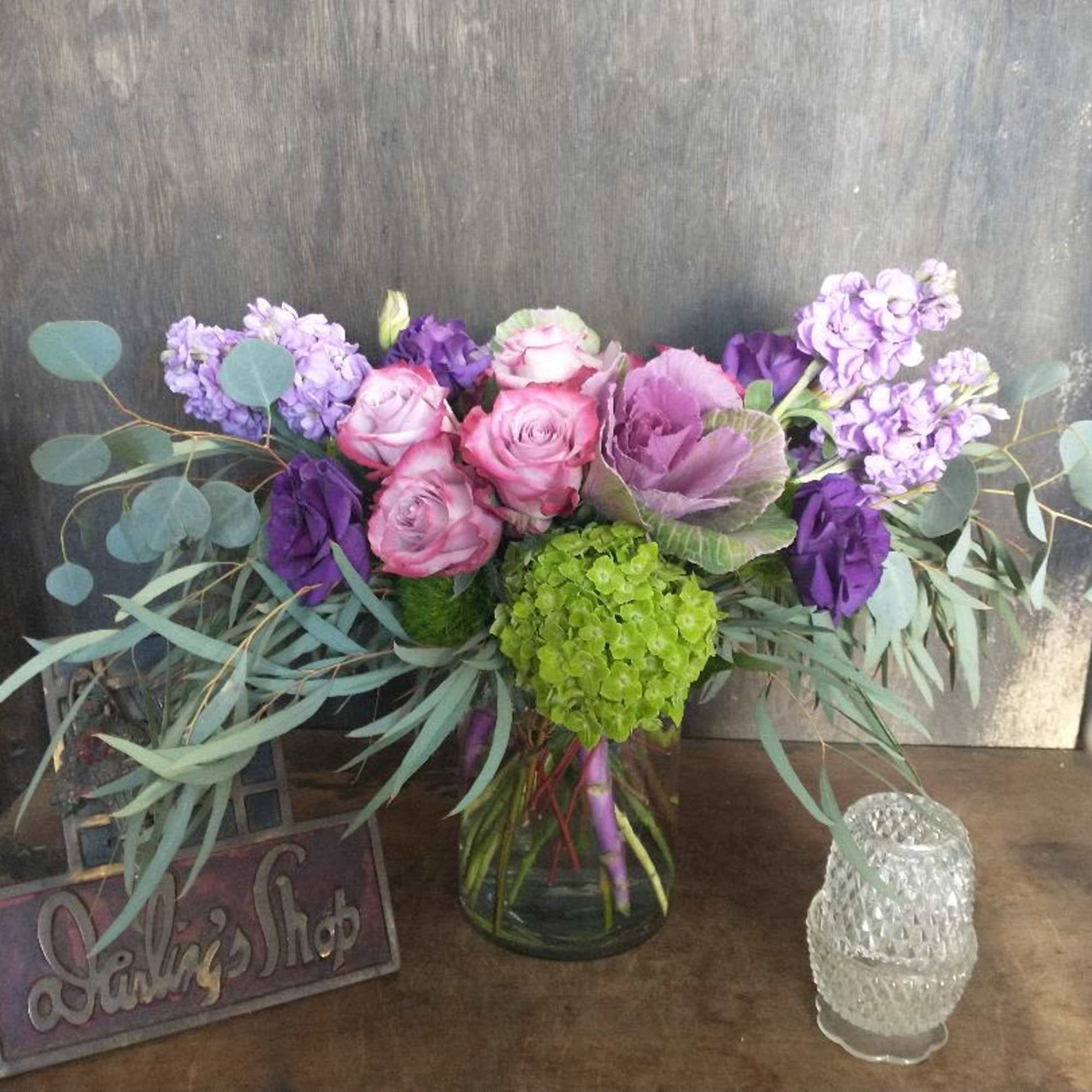 Bouquet of pink and purple flowers in a glass vase