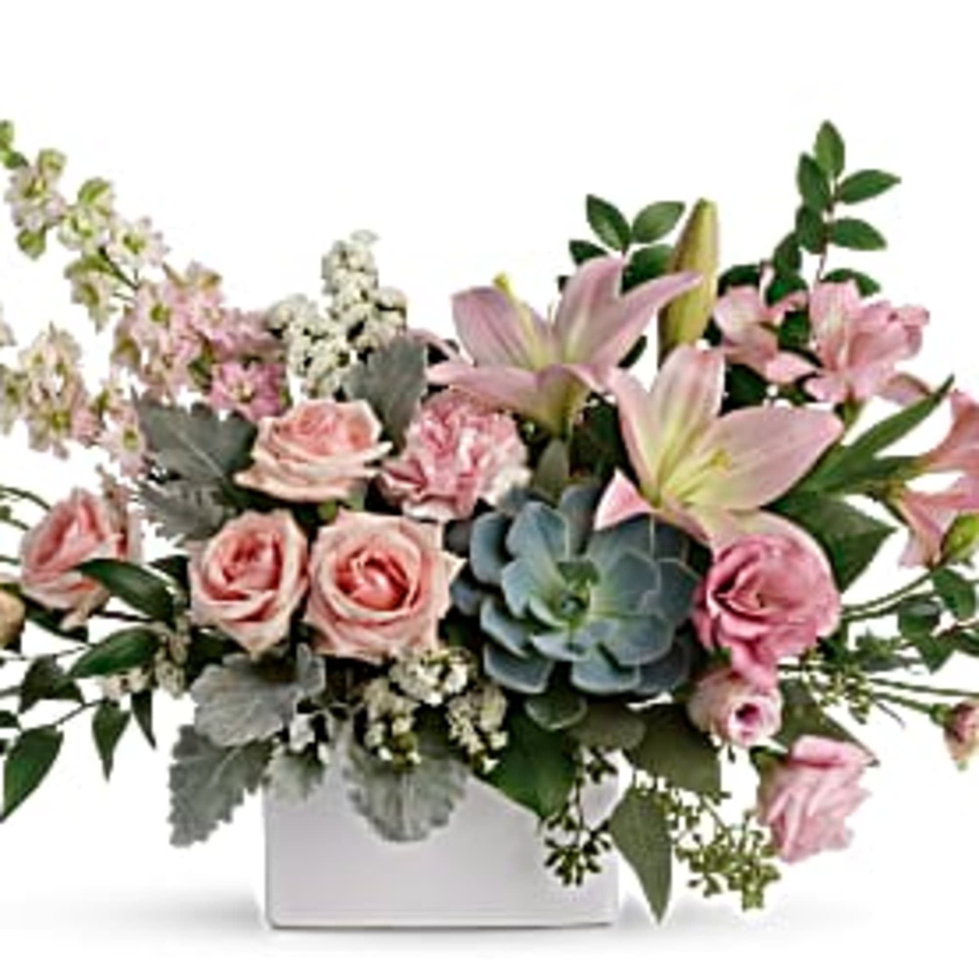 Low pink rose and lily arrangement with a succulent in a white rectangular vase