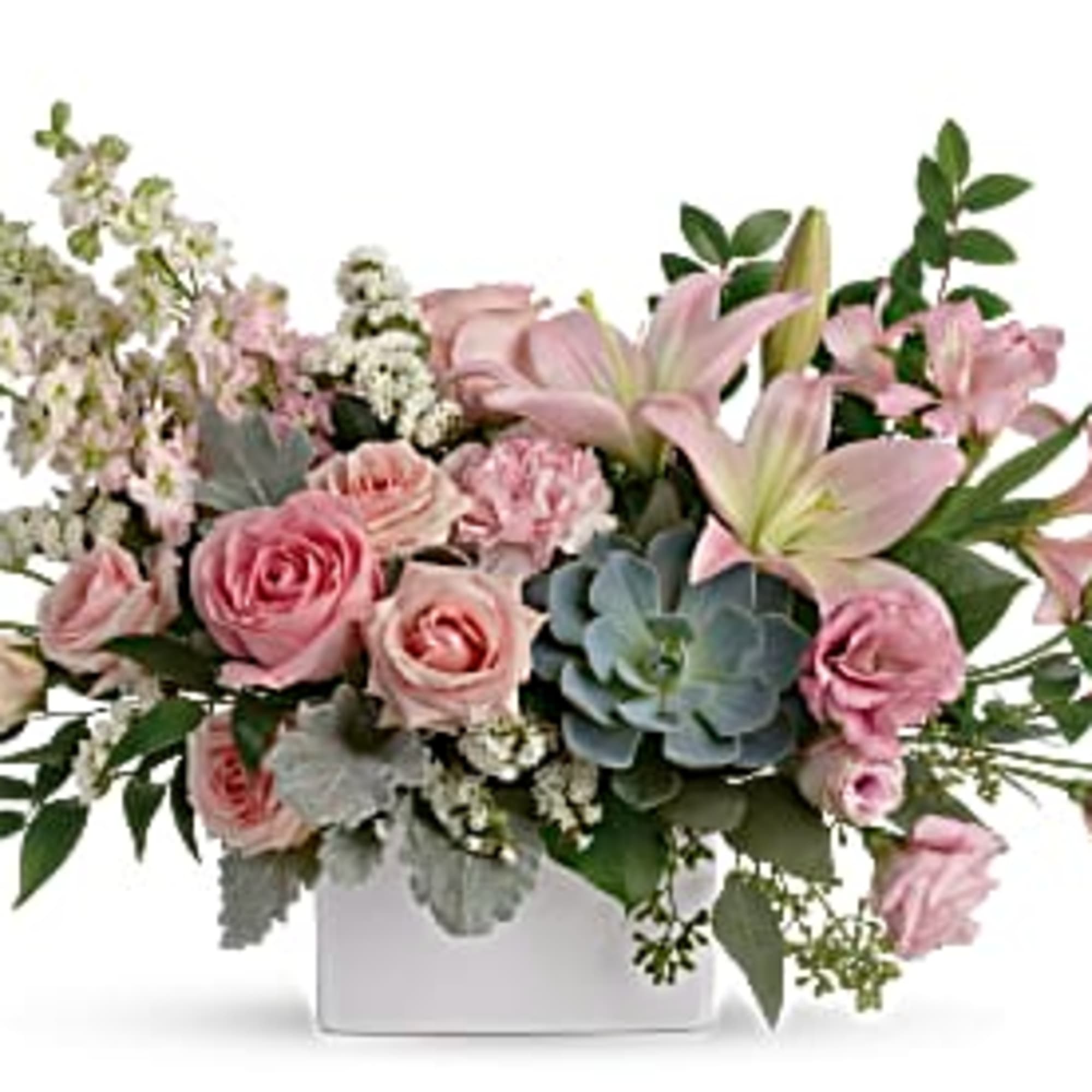 Low pastel pink rose and lily arrangement with succulent in a white rectangular vase
