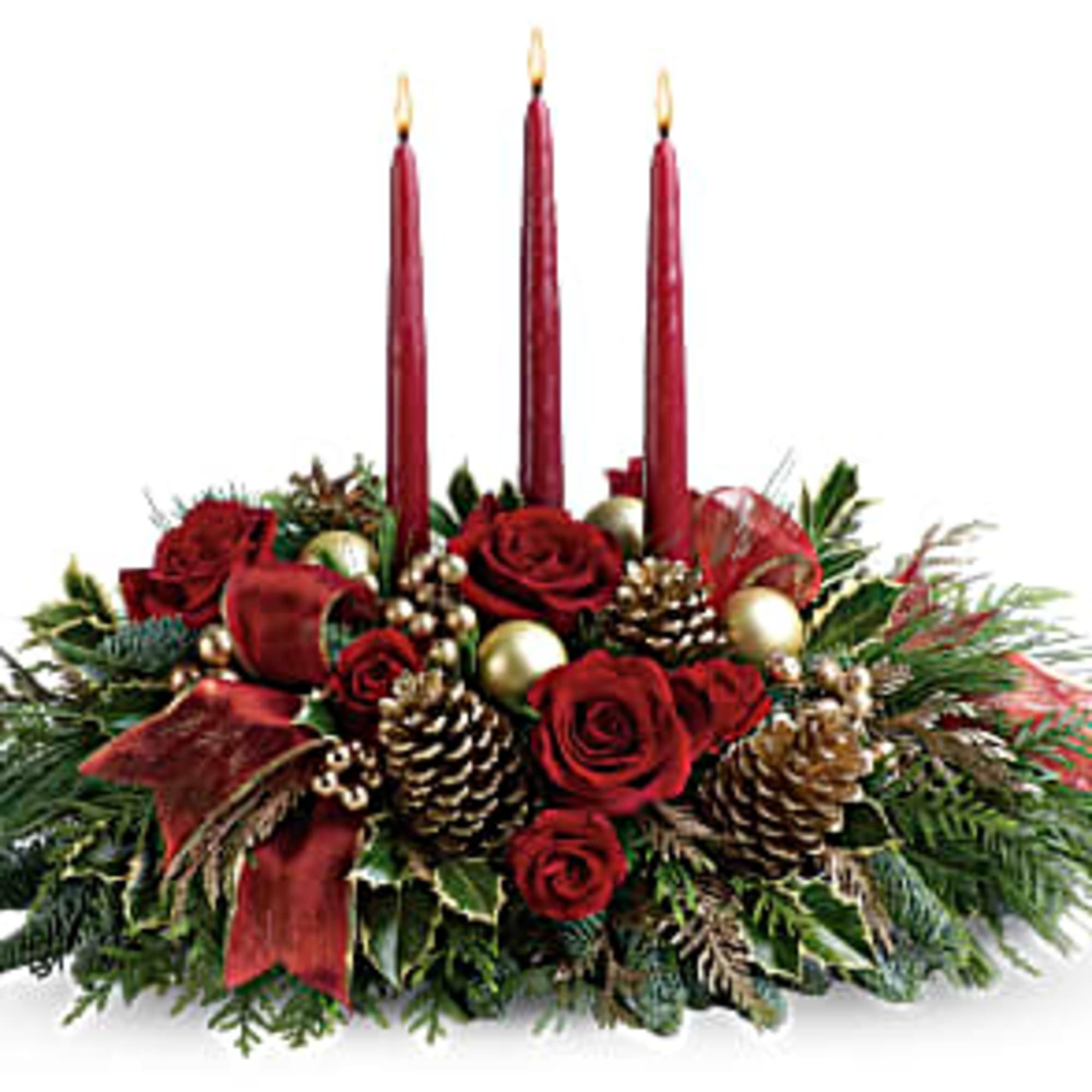 Red rose centerpiece with three tall candles and pinecones