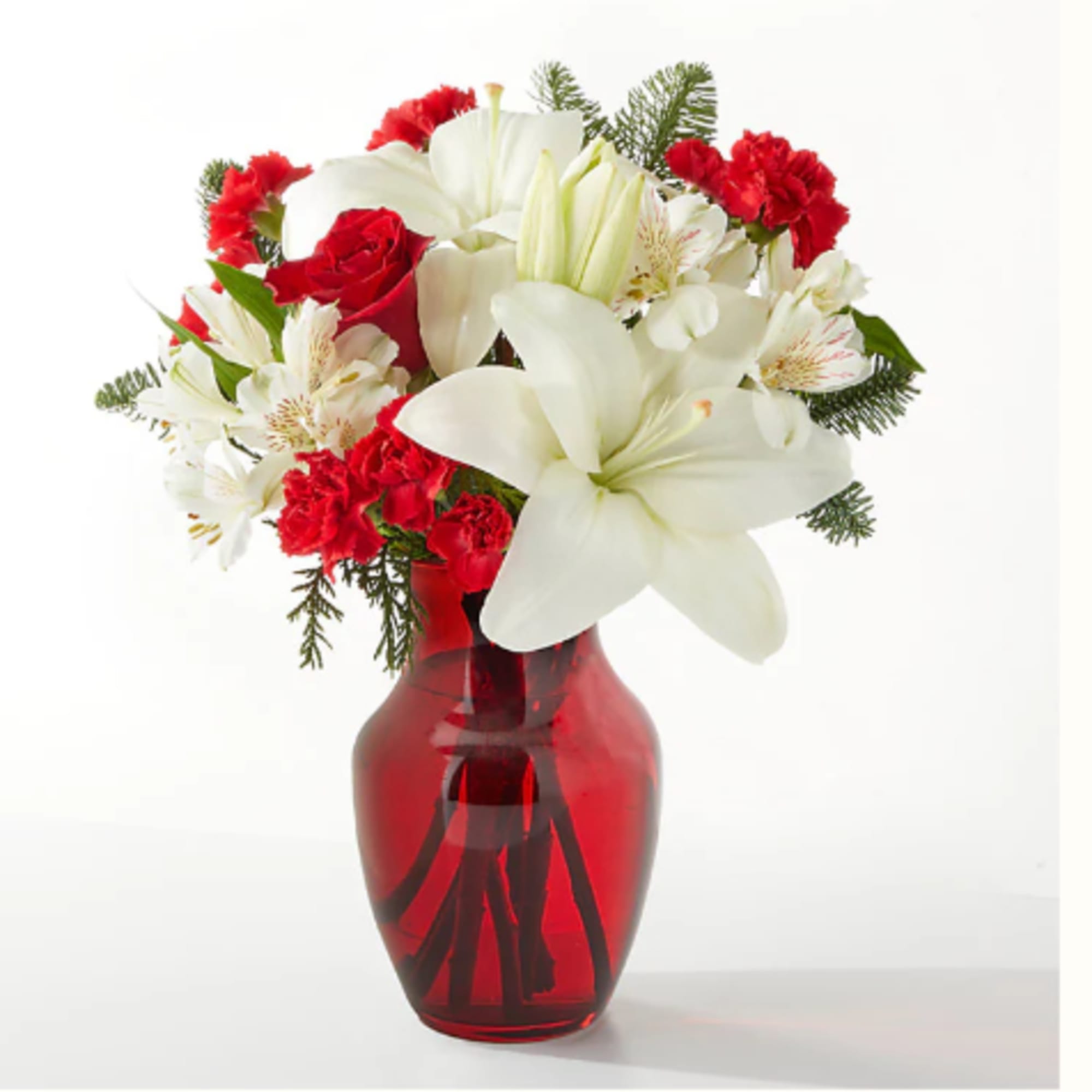Red and white bouquet in a red glass vase
