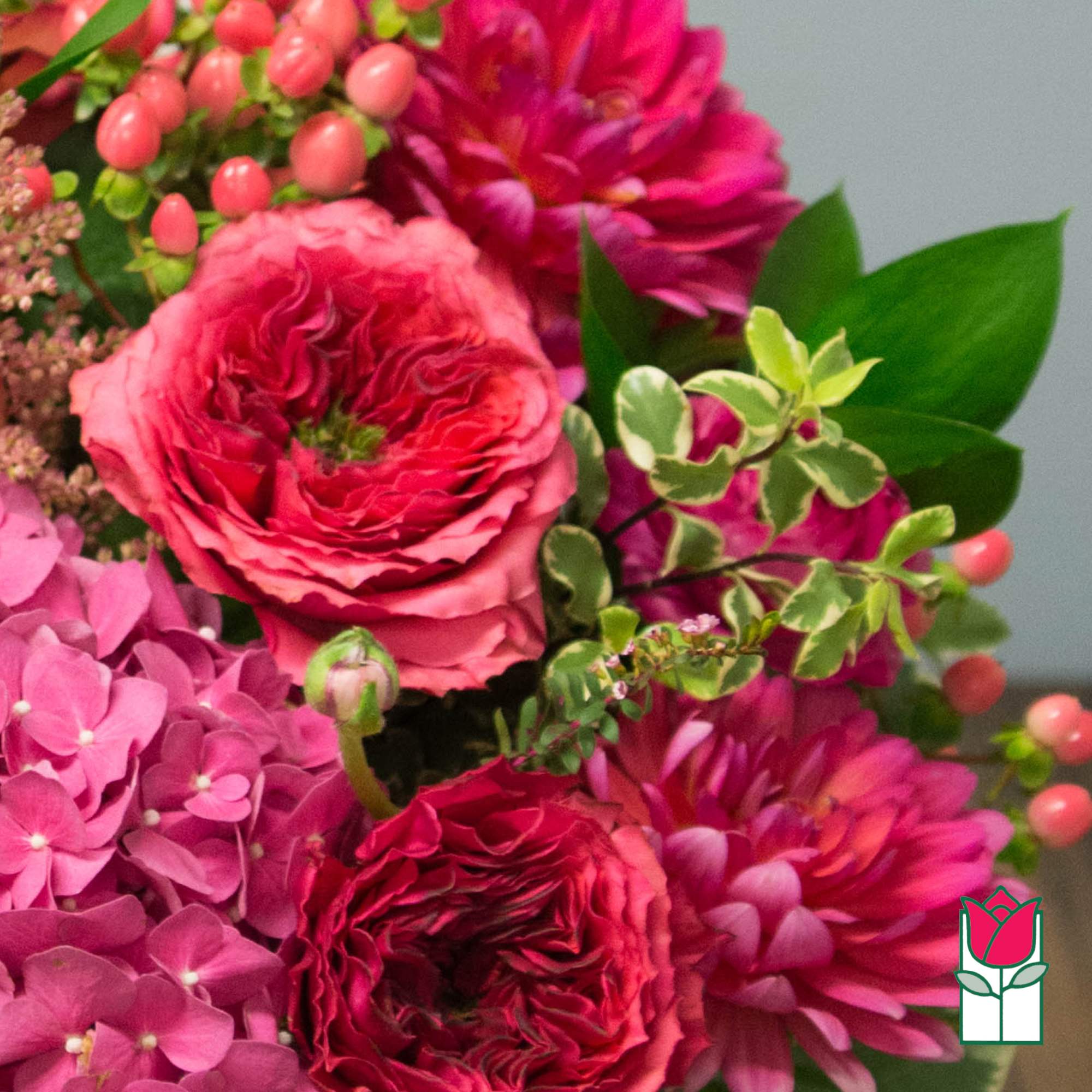 Pink and magenta bouquet with roses, dahlias, and hydrangeas