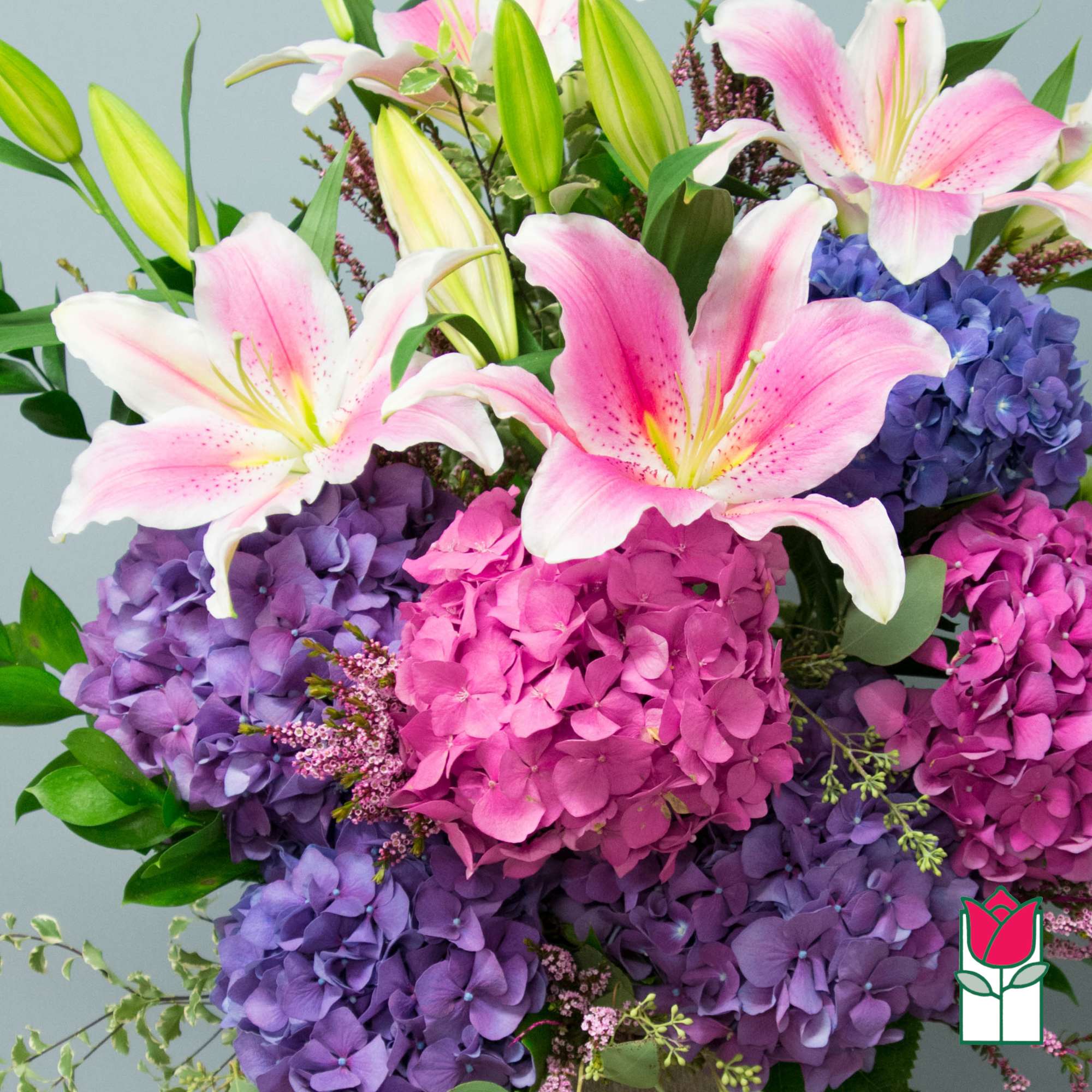 Bouquet of pink lilies and purple hydrangeas