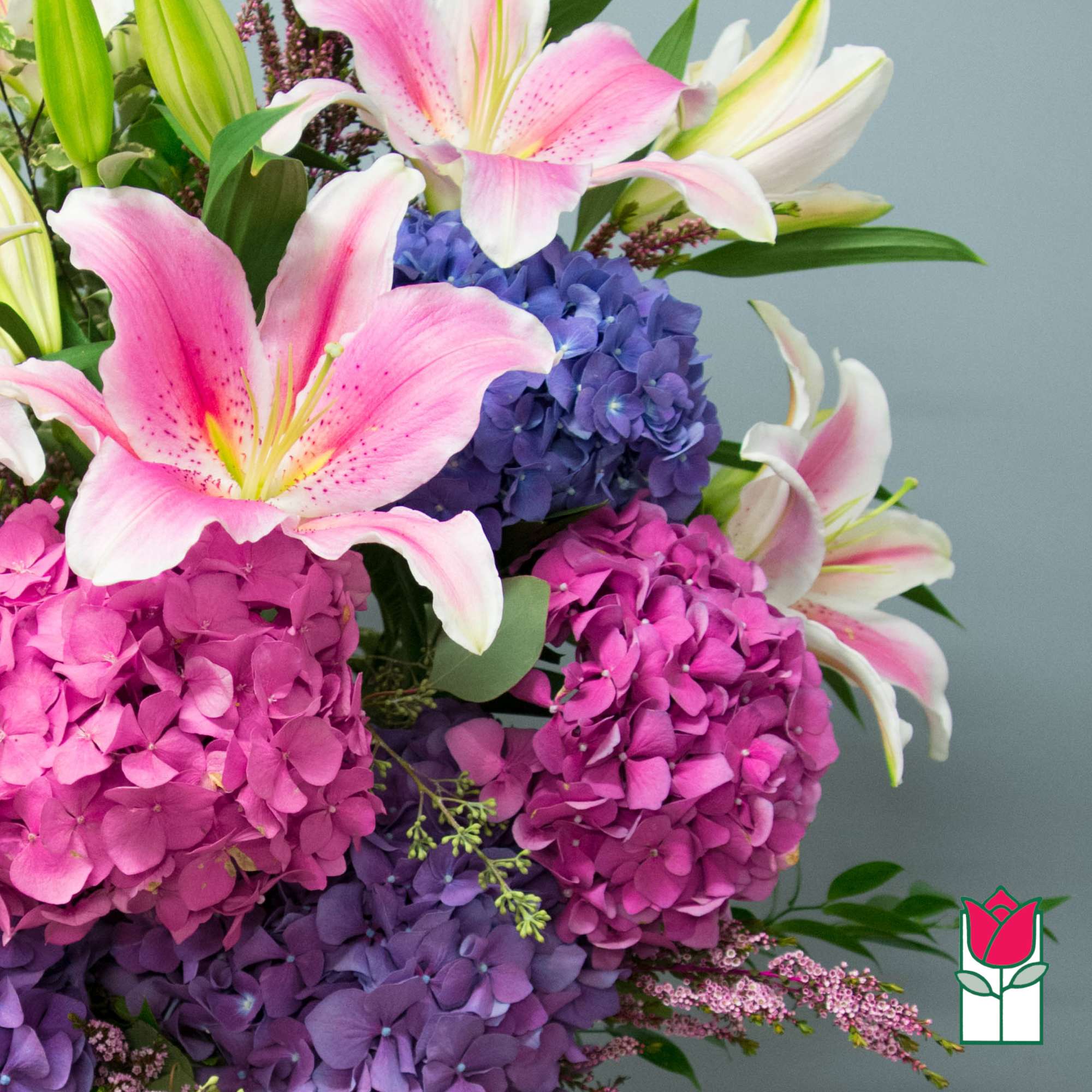 Bouquet of pink lilies and purple hydrangeas