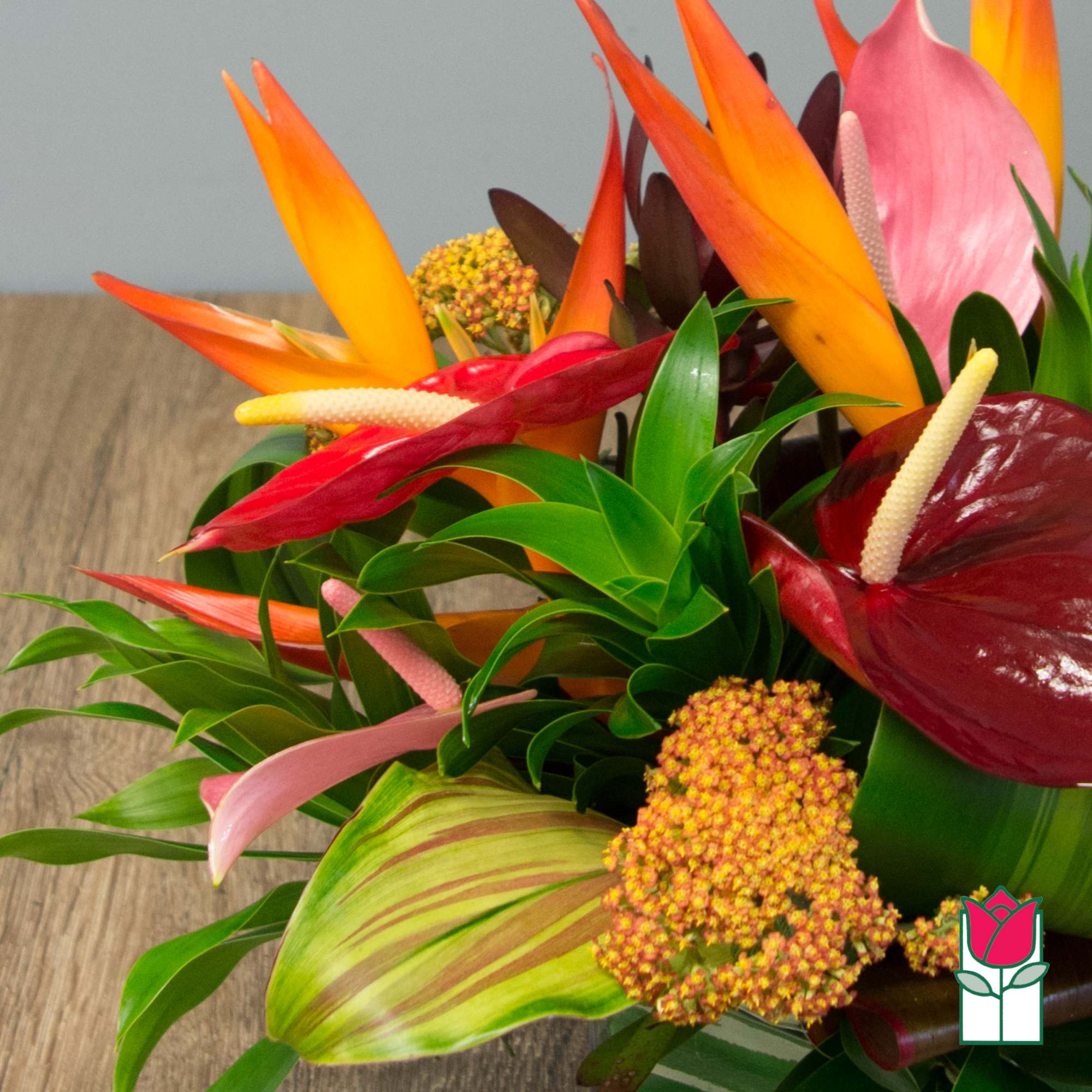 Tropical bouquet with orange bird of paradise and red anthuriums