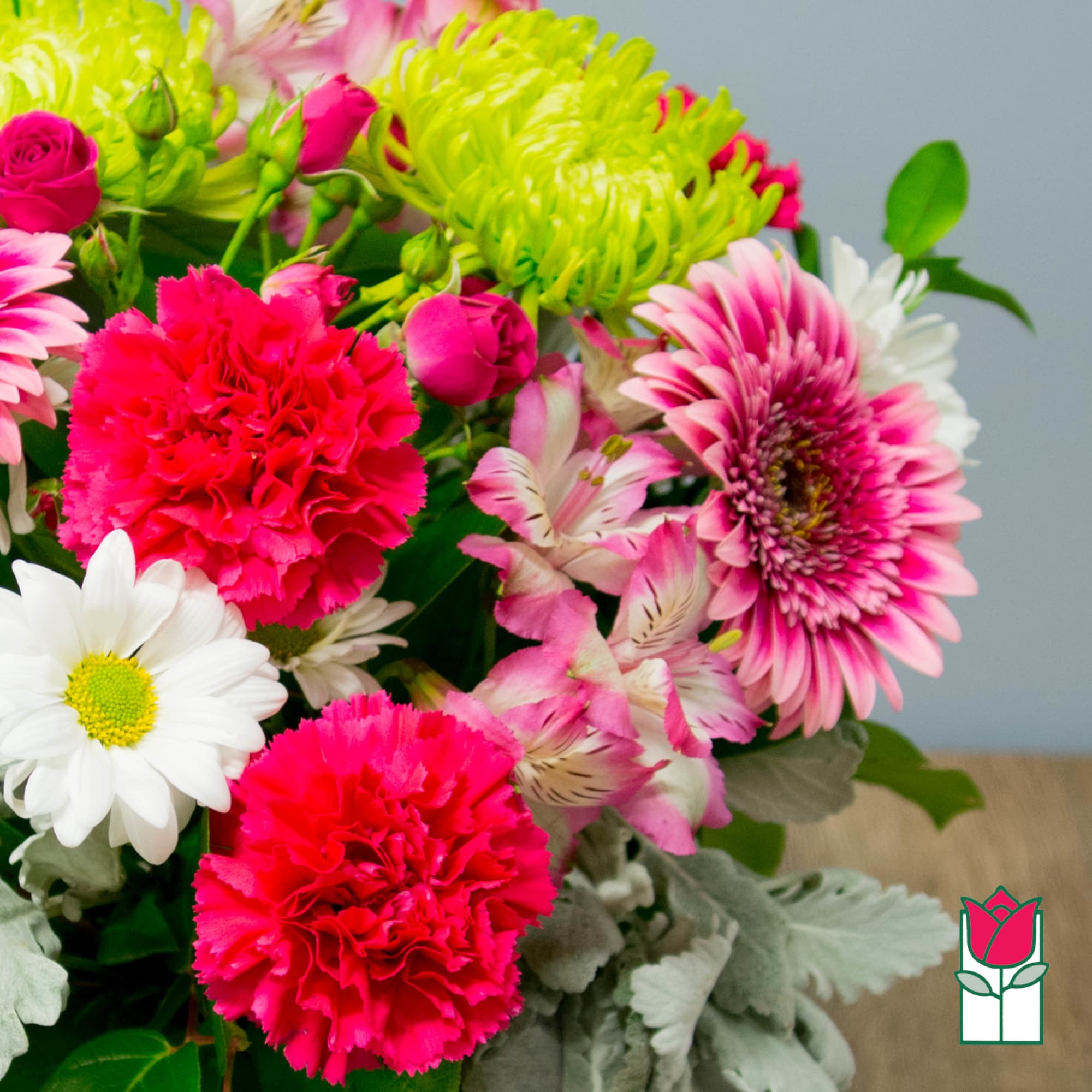 Bright mixed bouquet with pink carnations, daisies, and chrysanthemums