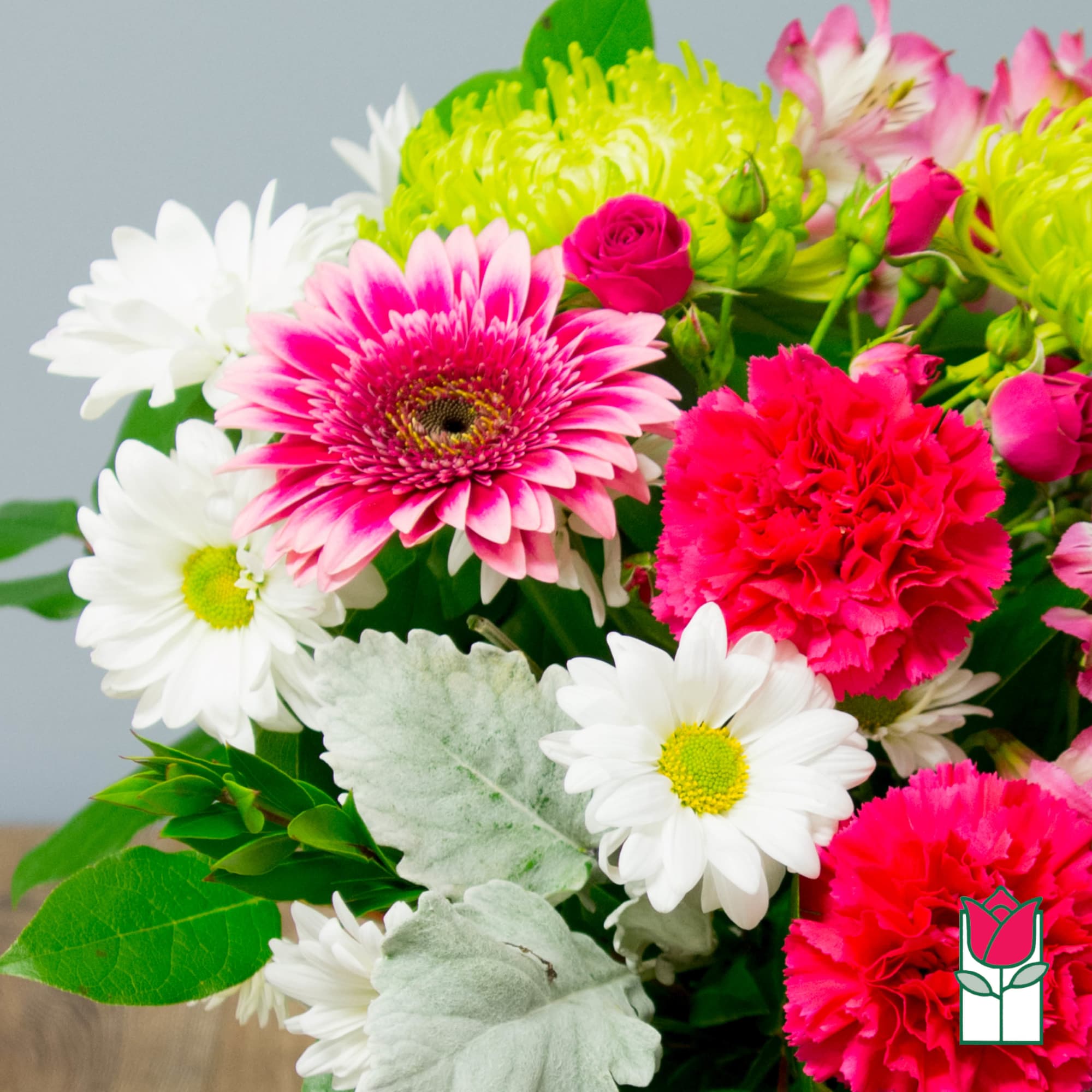 Bouquet of pink gerbera daisies, white daisies, and hot pink carnations