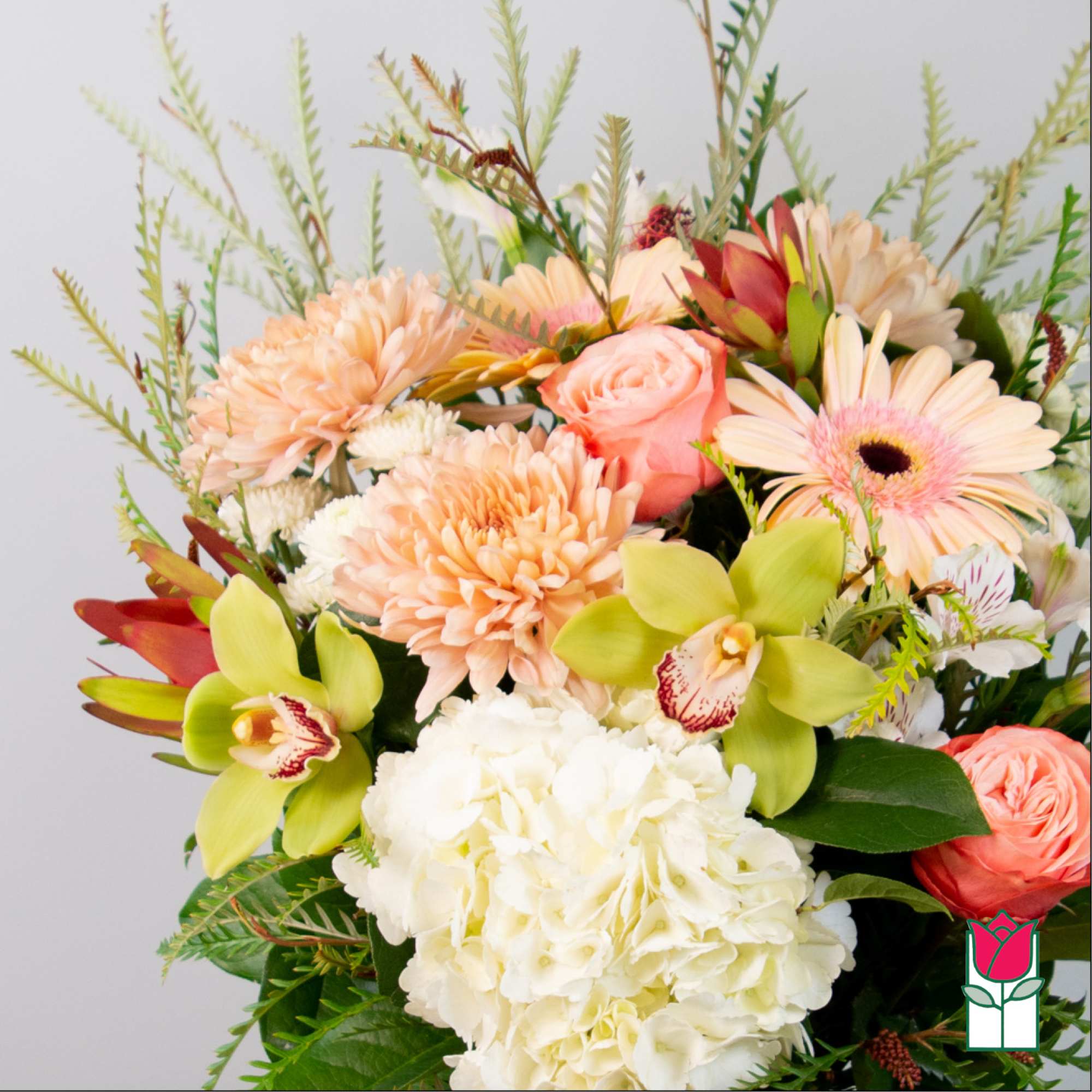 Mixed bouquet with peach, white, and green flowers