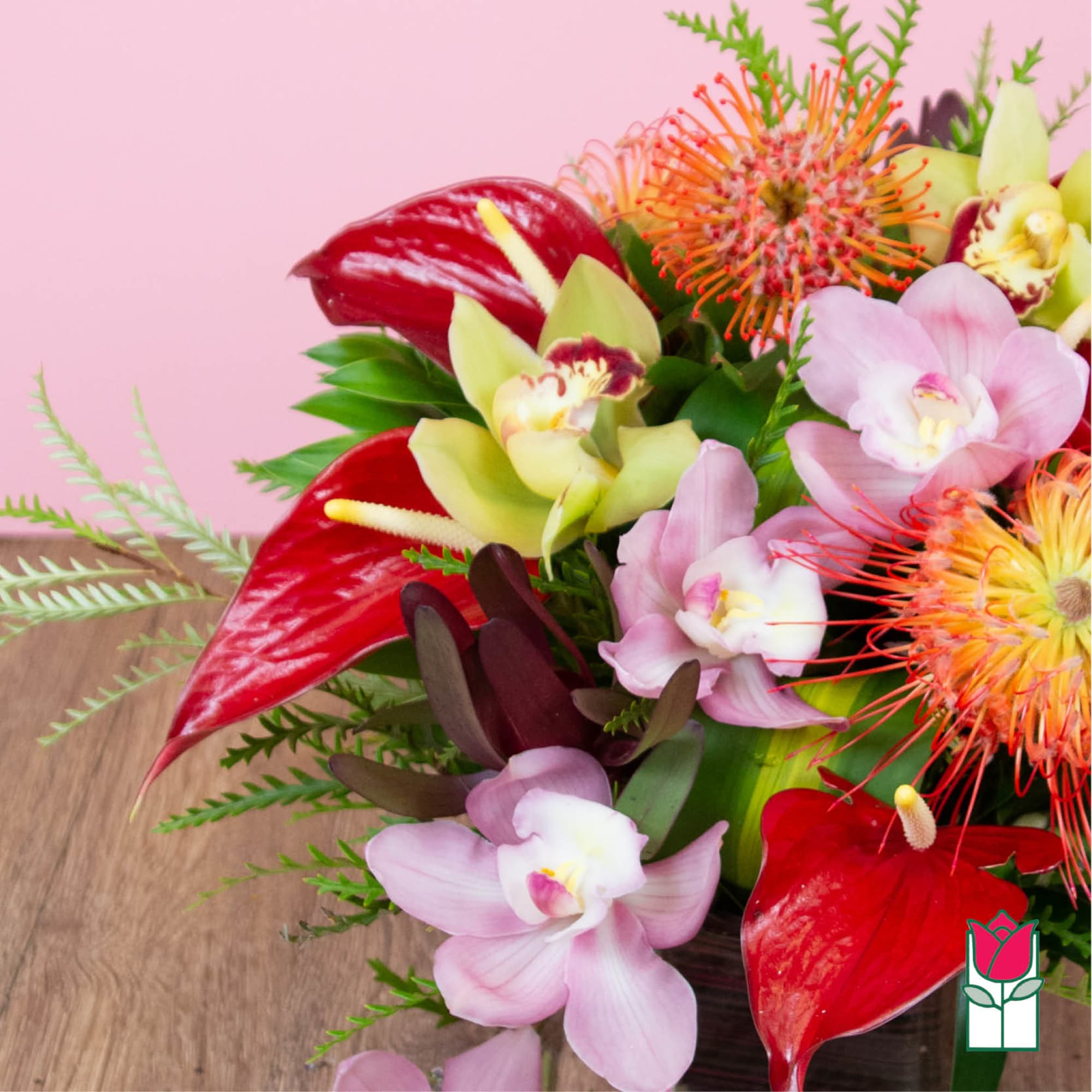 Tropical bouquet with red anthuriums and pink orchids