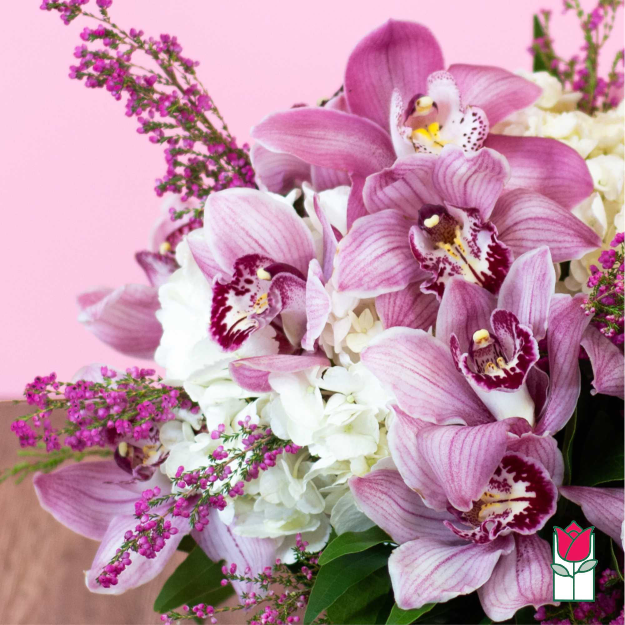 Pink orchids and white hydrangeas with small purple filler flowers