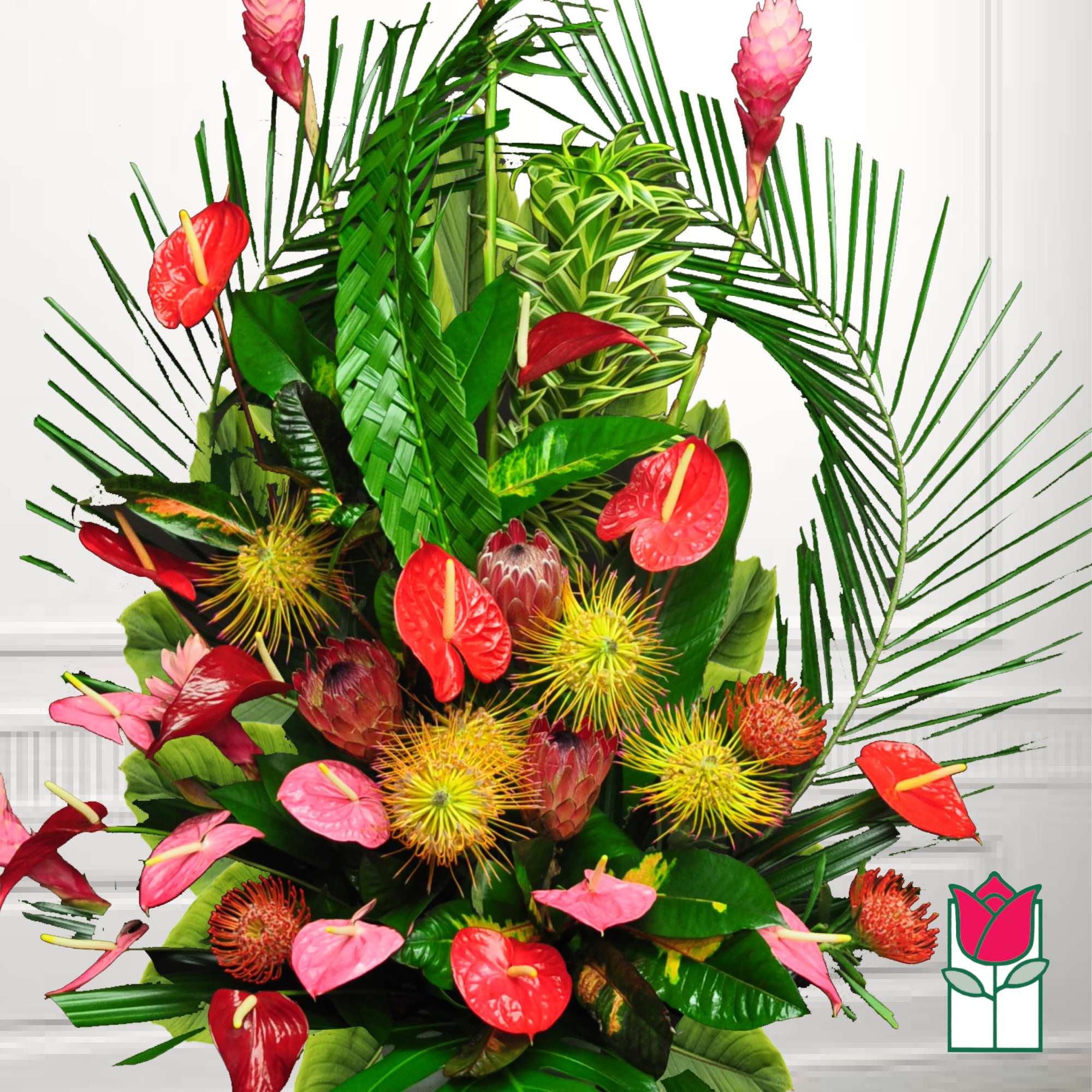 Tropical arrangement with red and pink anthuriums and spiky blooms
