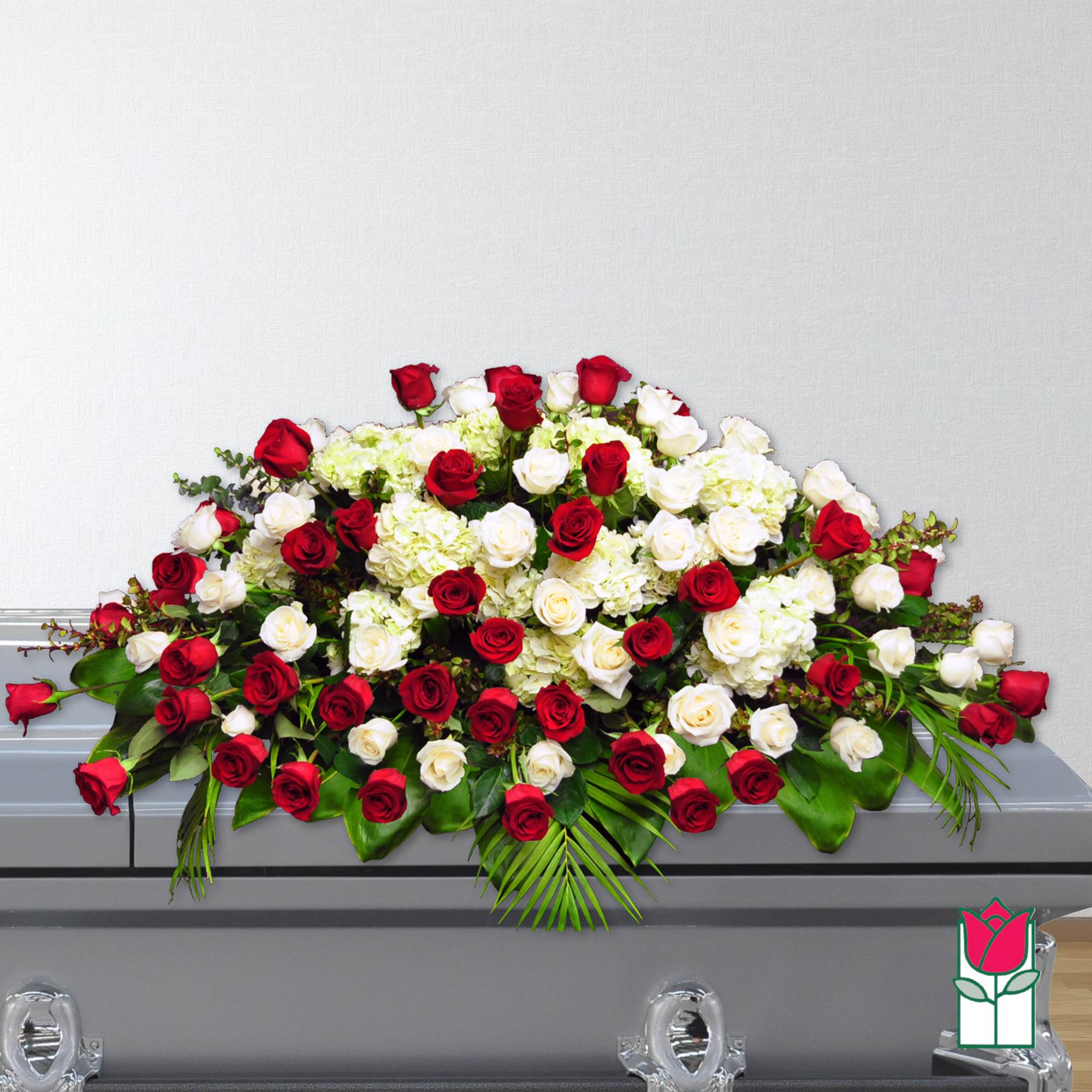 Red and white rose casket spray with hydrangeas