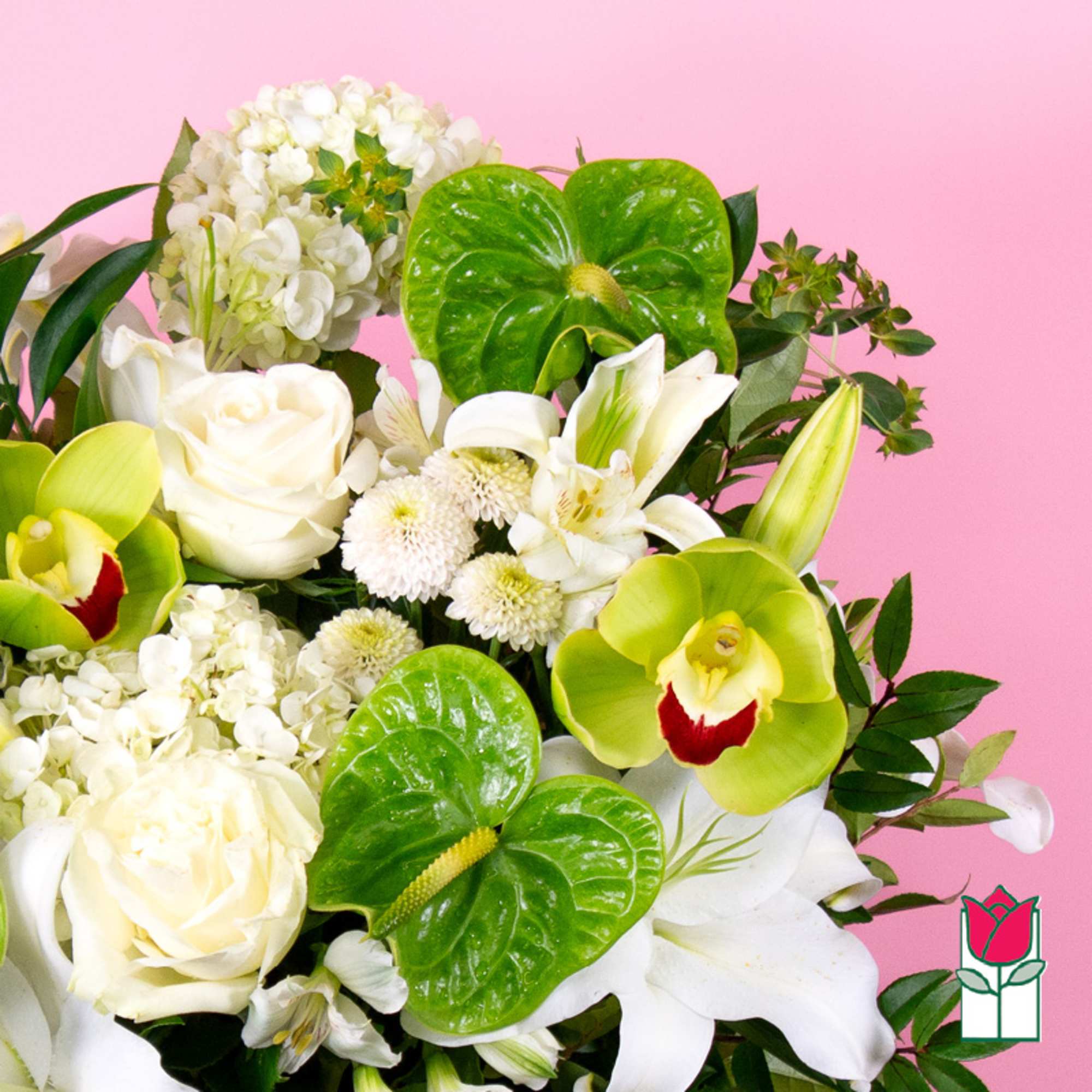 White roses and lilies with green orchids in a bouquet
