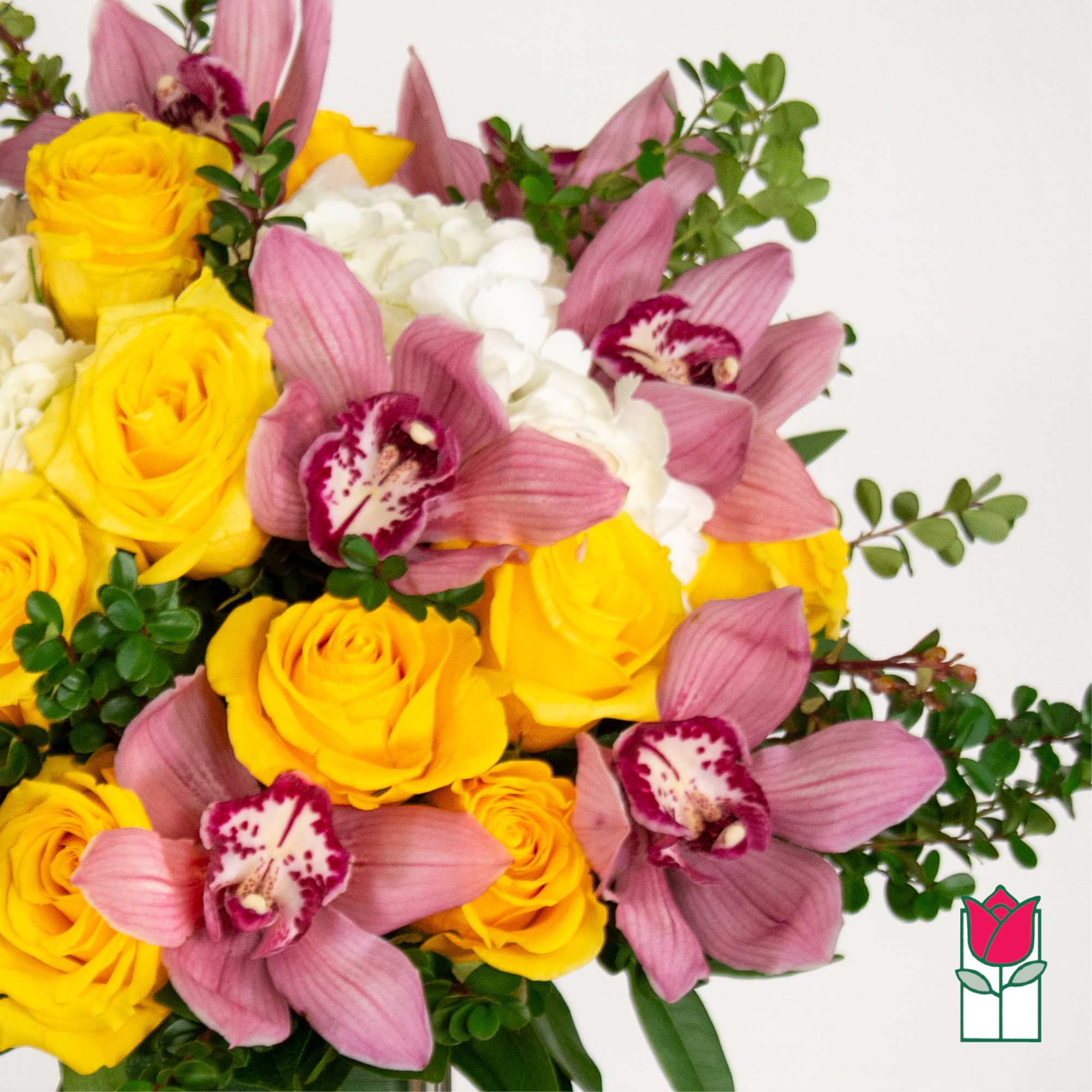 Bouquet of yellow roses and pink orchids with white blooms