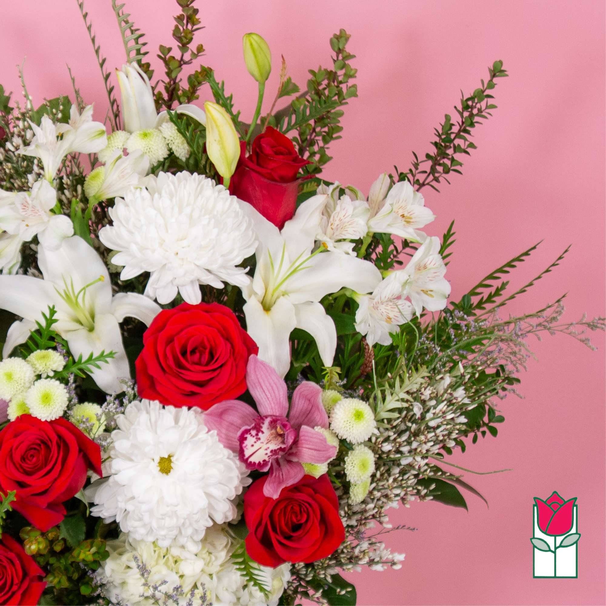 Bouquet of red roses, white lilies, and white chrysanthemums on a pink background
