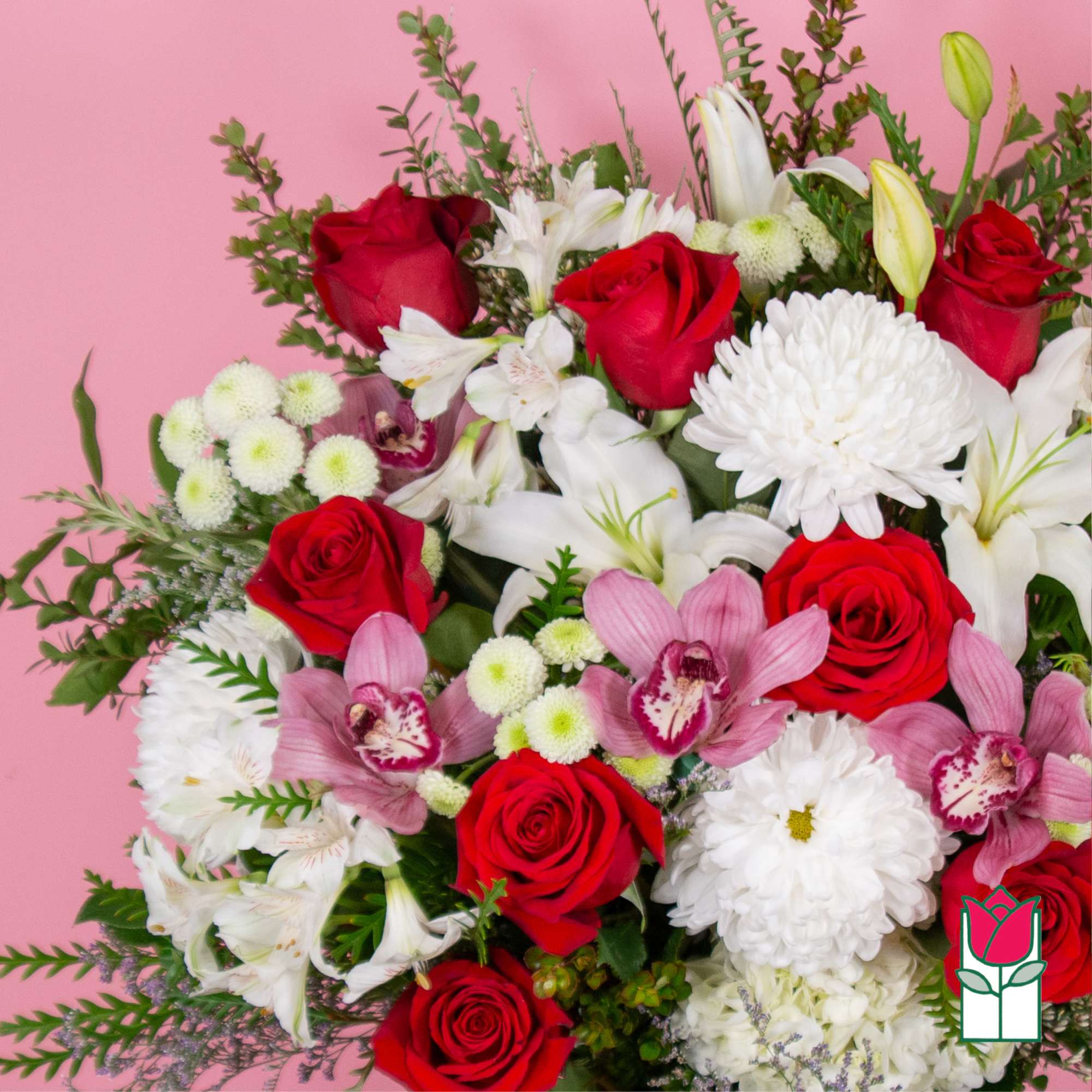 Bouquet of red roses, white lilies, and pink orchids on a pink background