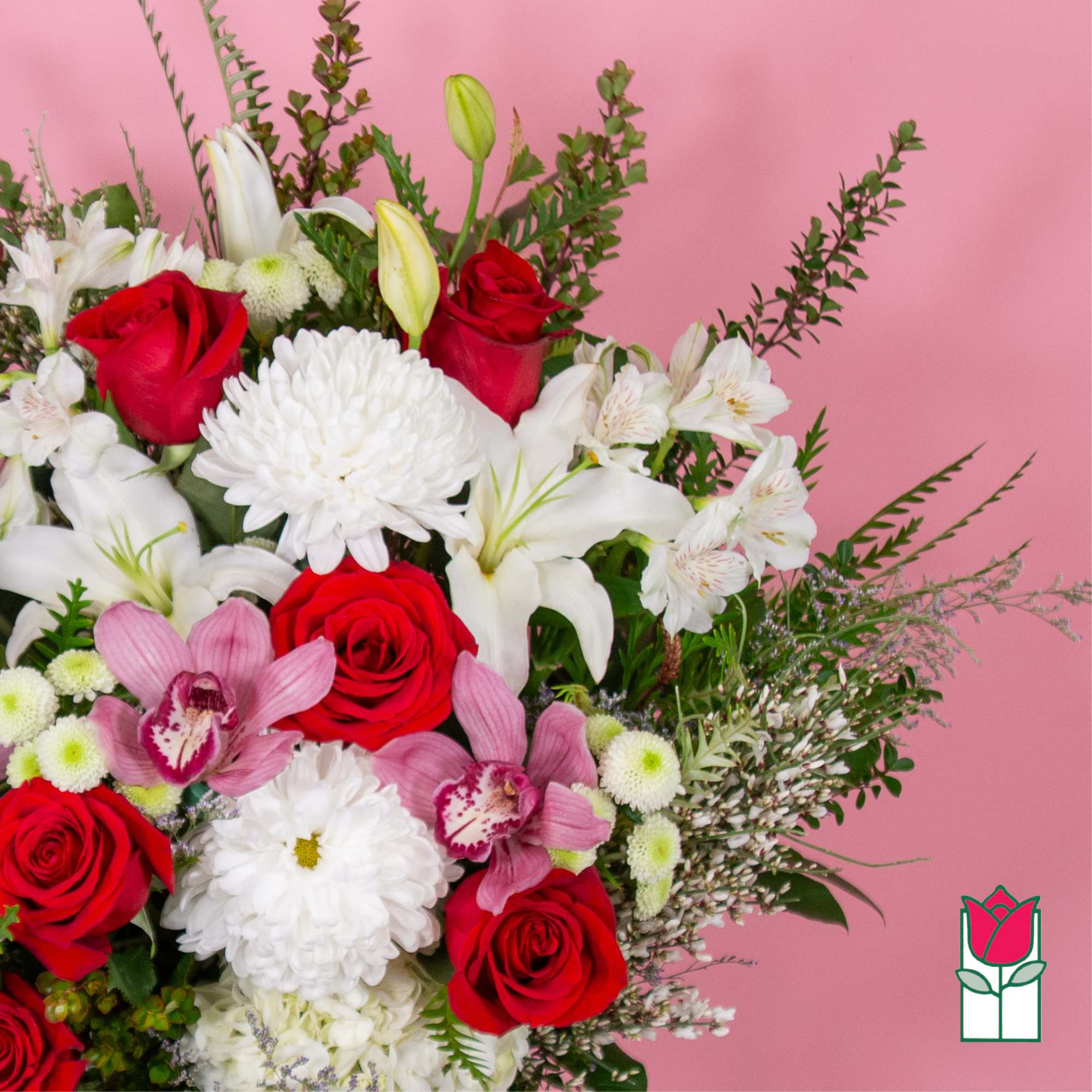 Bouquet of red roses, white lilies, and pink orchids on a pink background